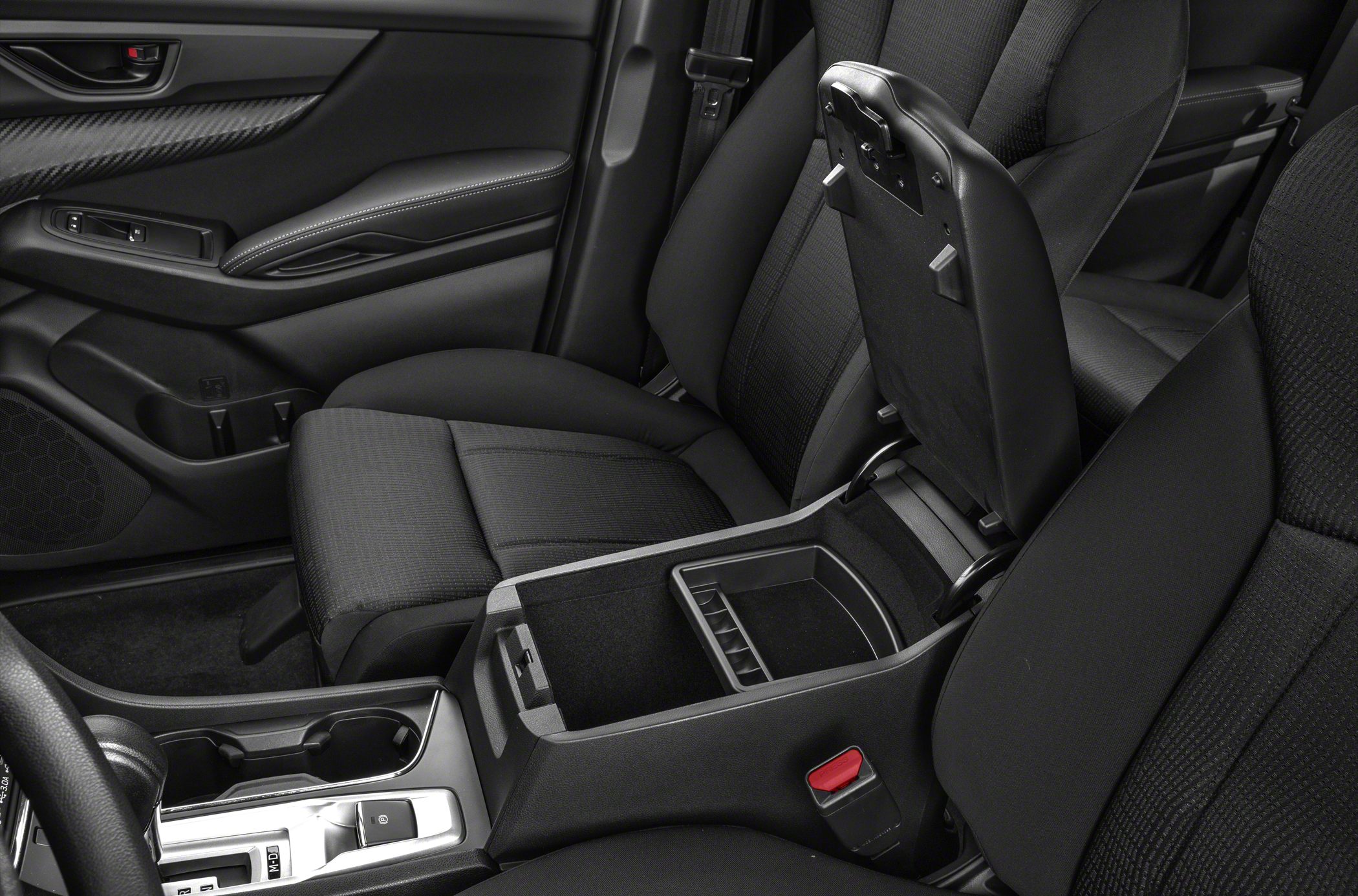 Open center console storage with dual cup holders and fabric seats