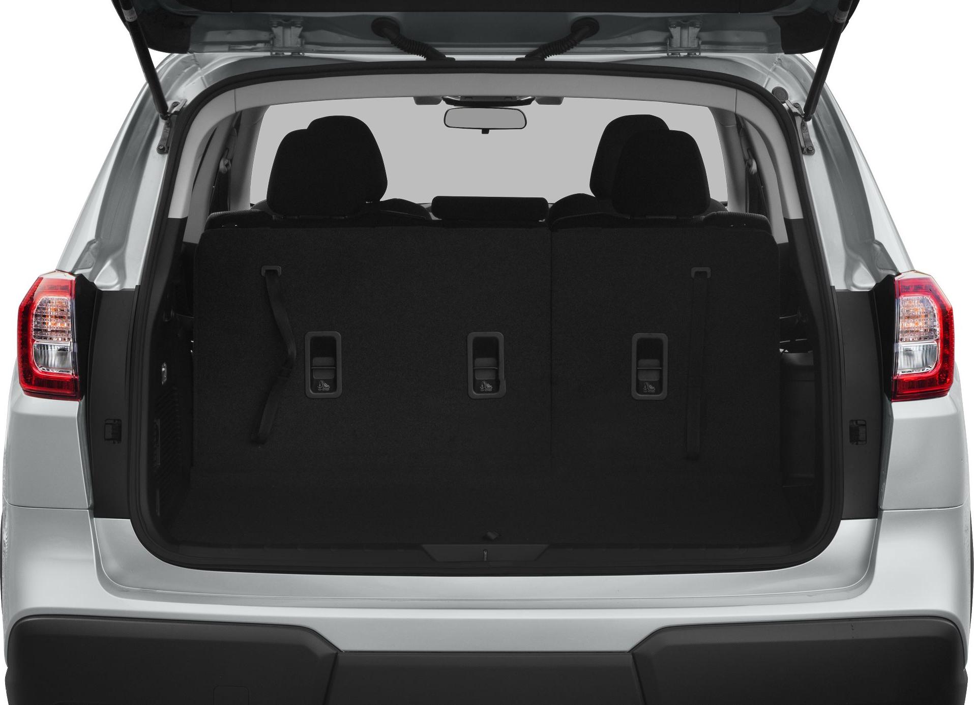 Rear cargo space with folded third-row seats and visible headrests.