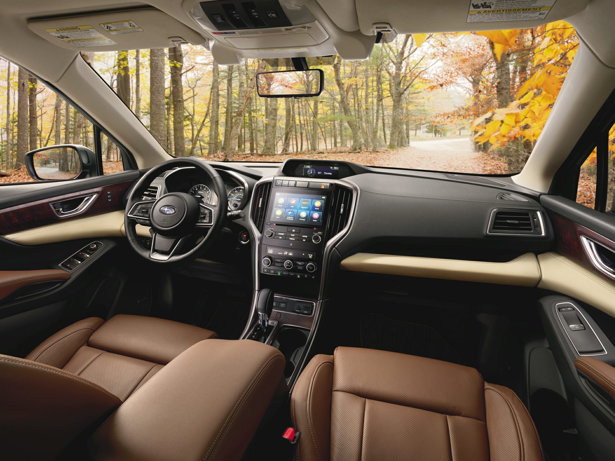 Brown leather seats and touchscreen infotainment system in spacious SUV interior