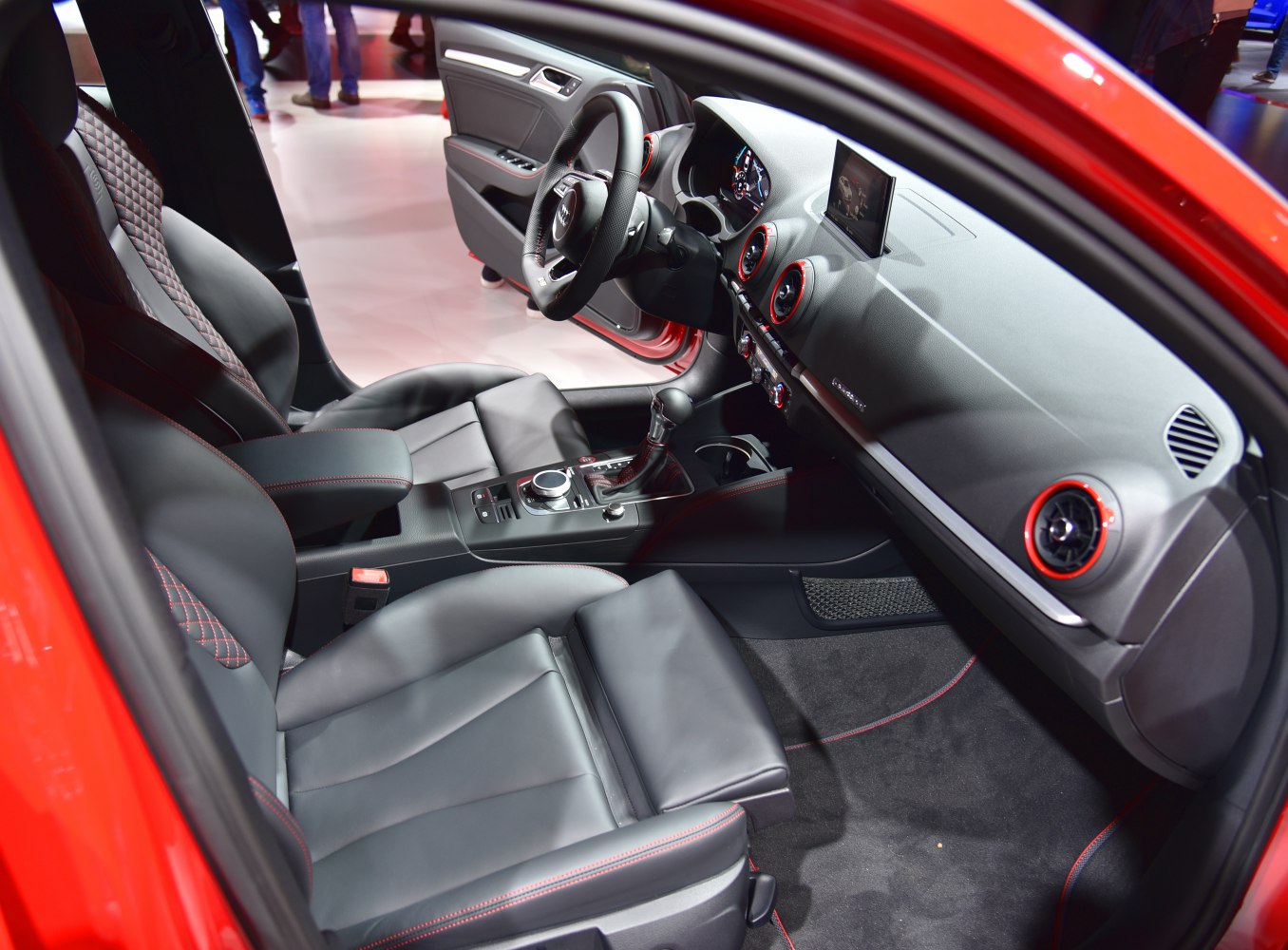 Luxury sporty interior with premium leather seats and red stitching