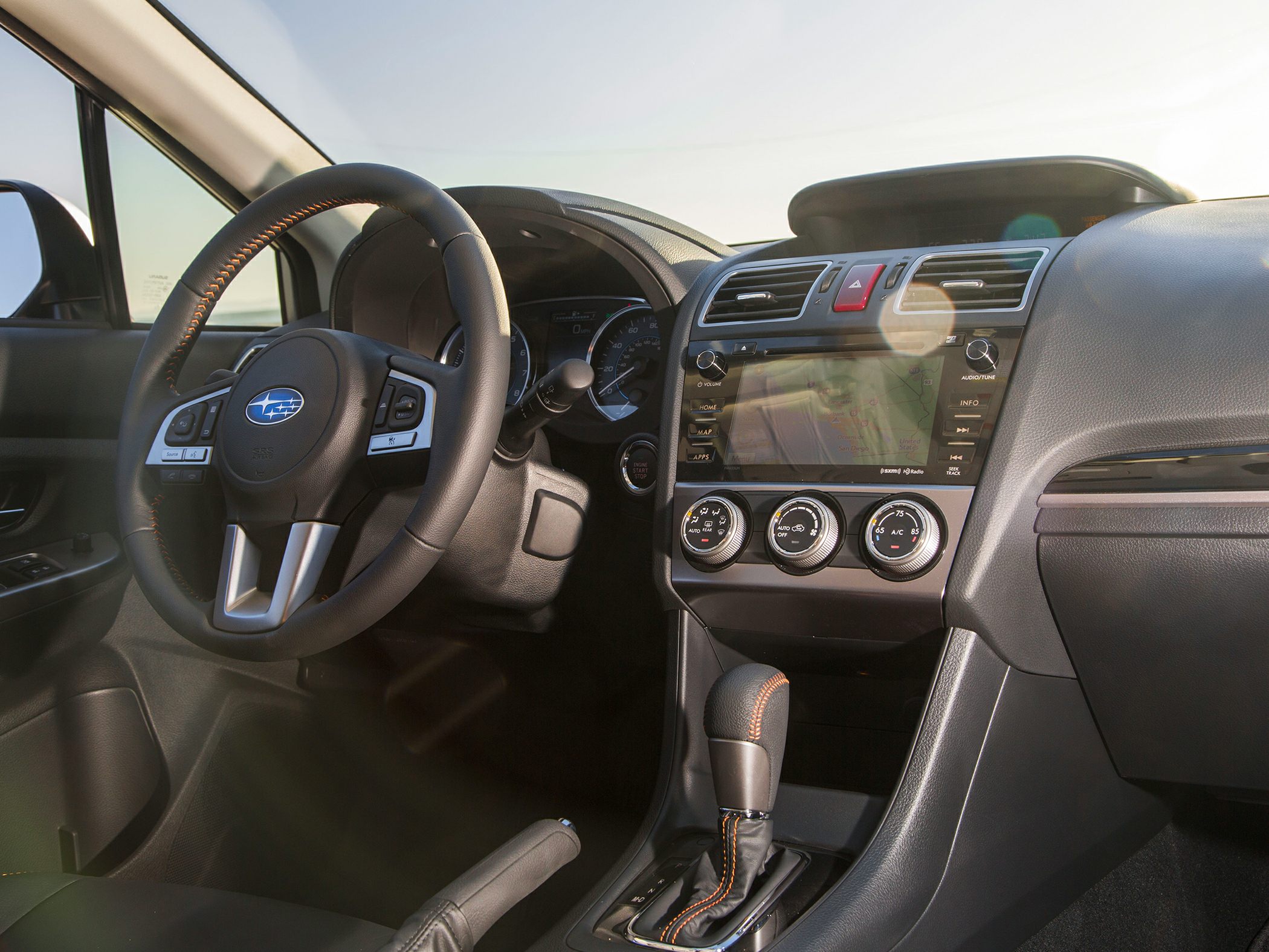 Interior dashboard with steering wheel and touchscreen navigation