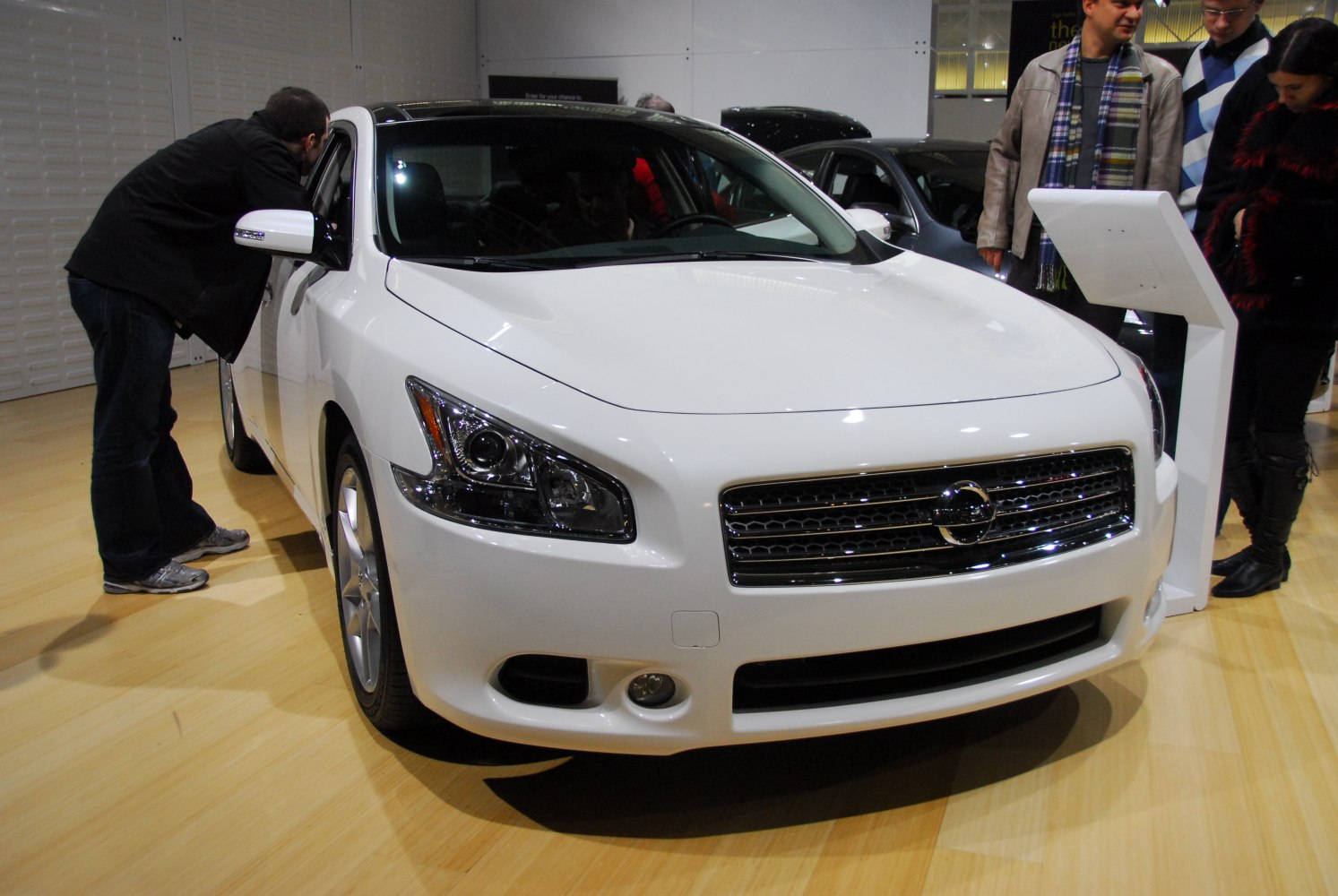 Front view showing car grille and headlights