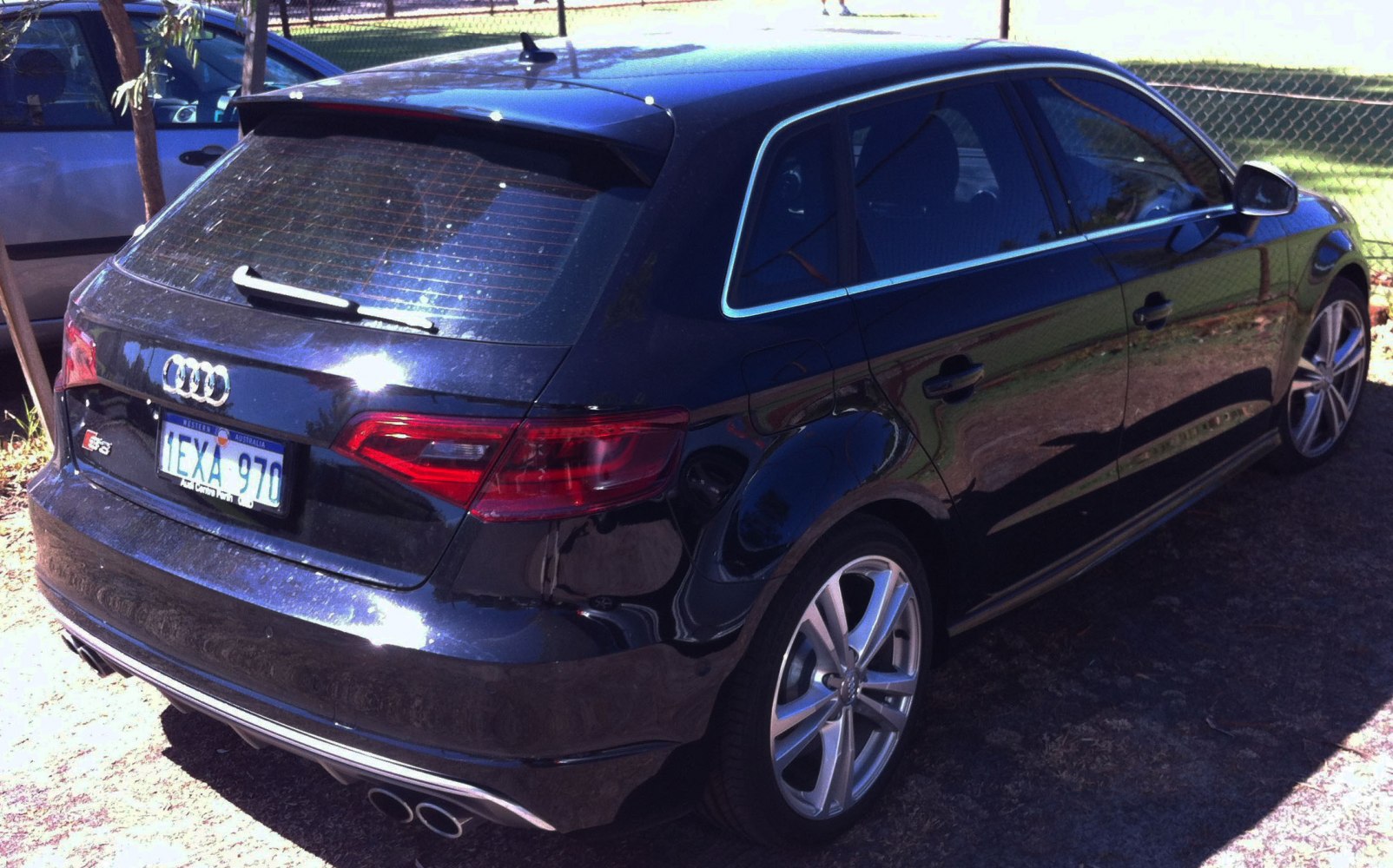 Rear and side view of a hatchback with dual exhaust and LED tailights