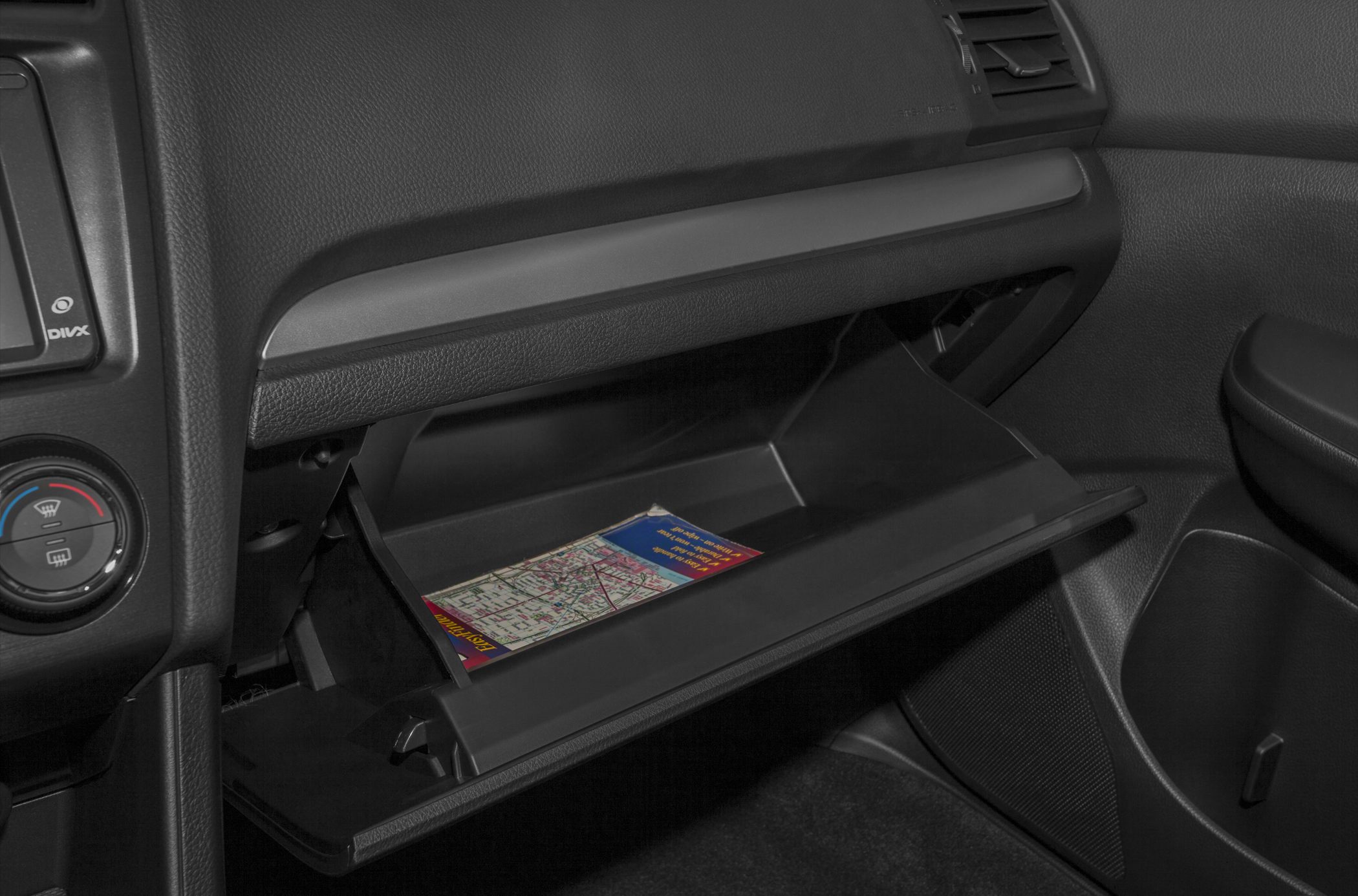 Open glove compartment with a map inside
