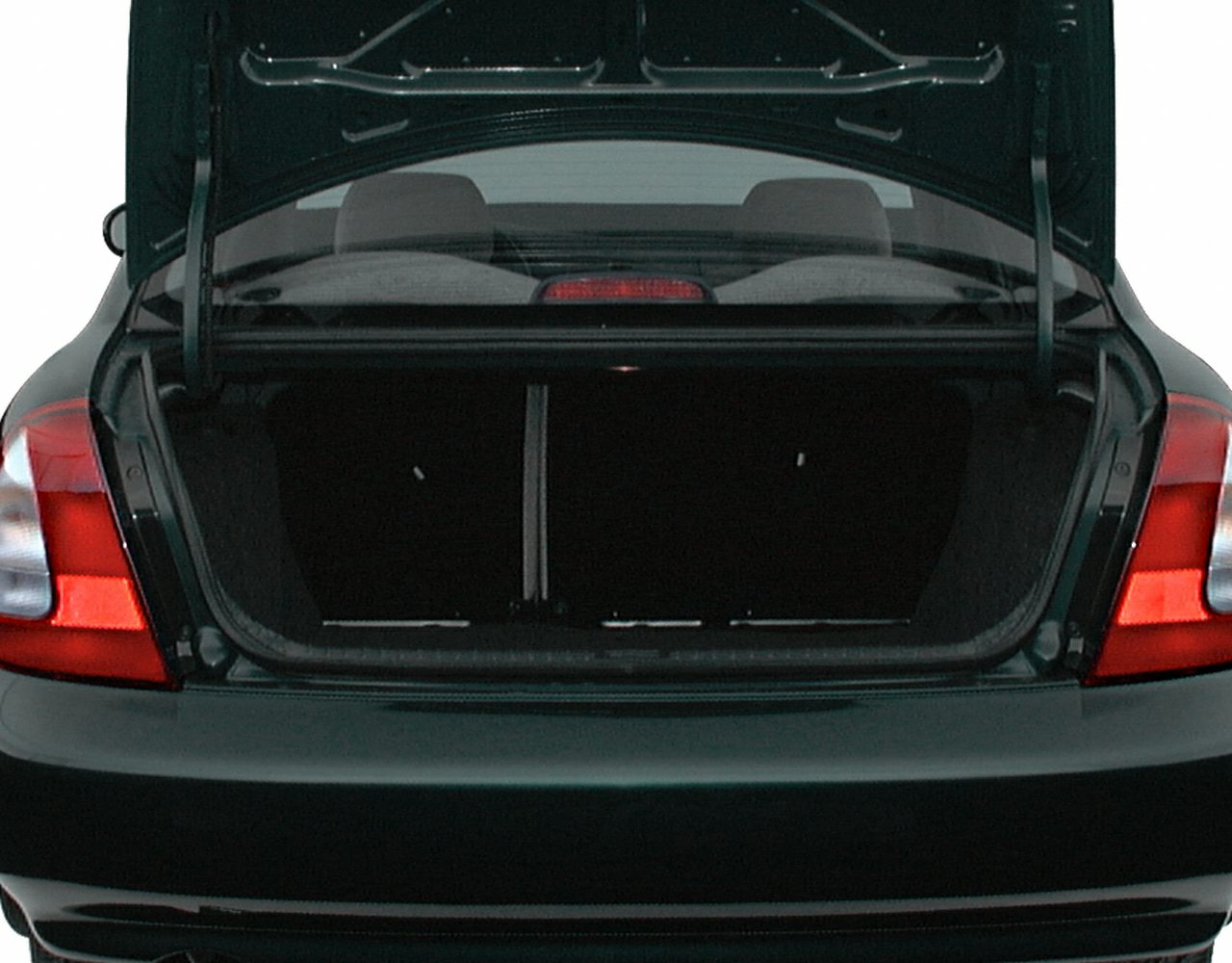 Open sedan trunk with visible rear seats and tail lights.