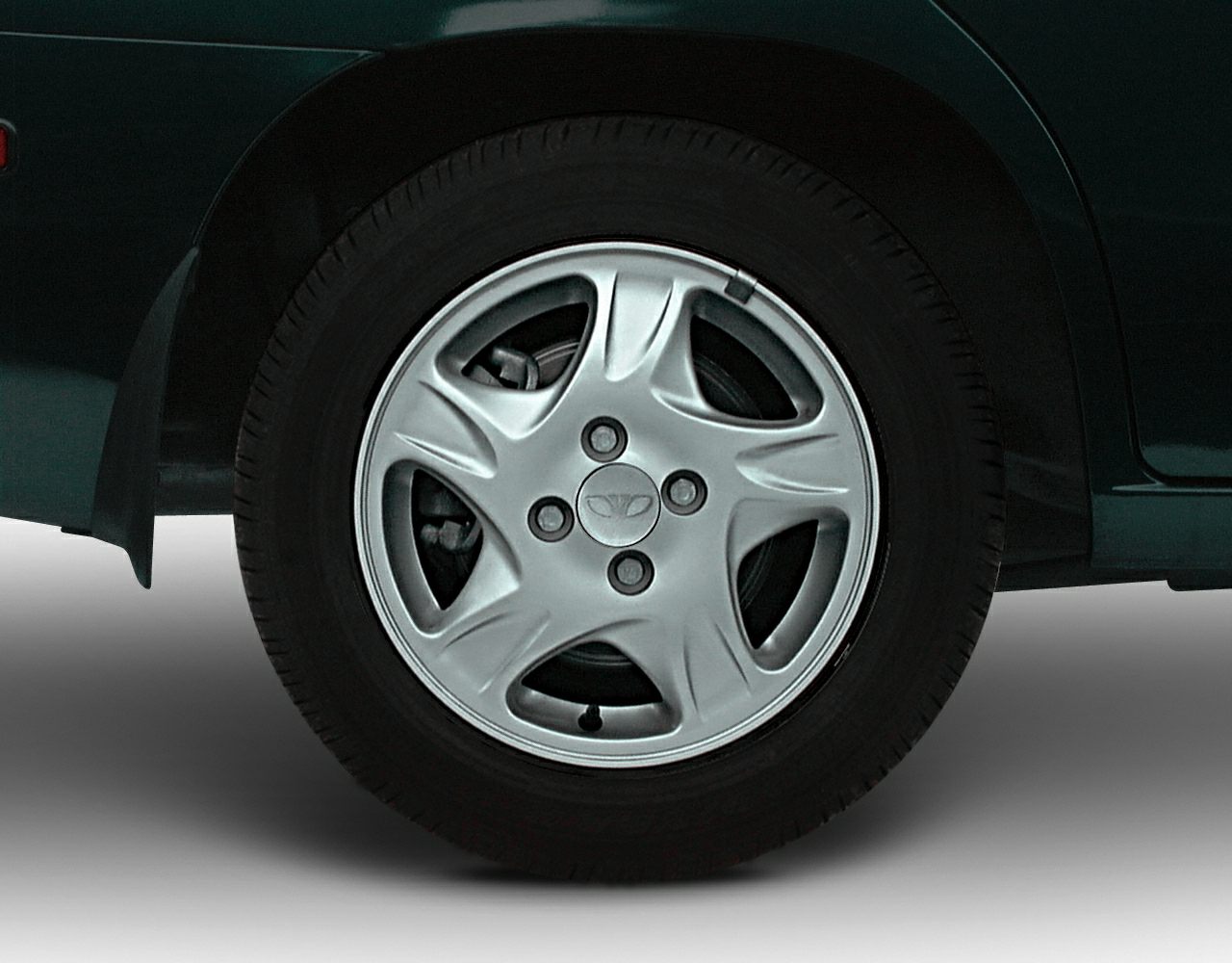Close-up of wheel with alloy rim design and tire