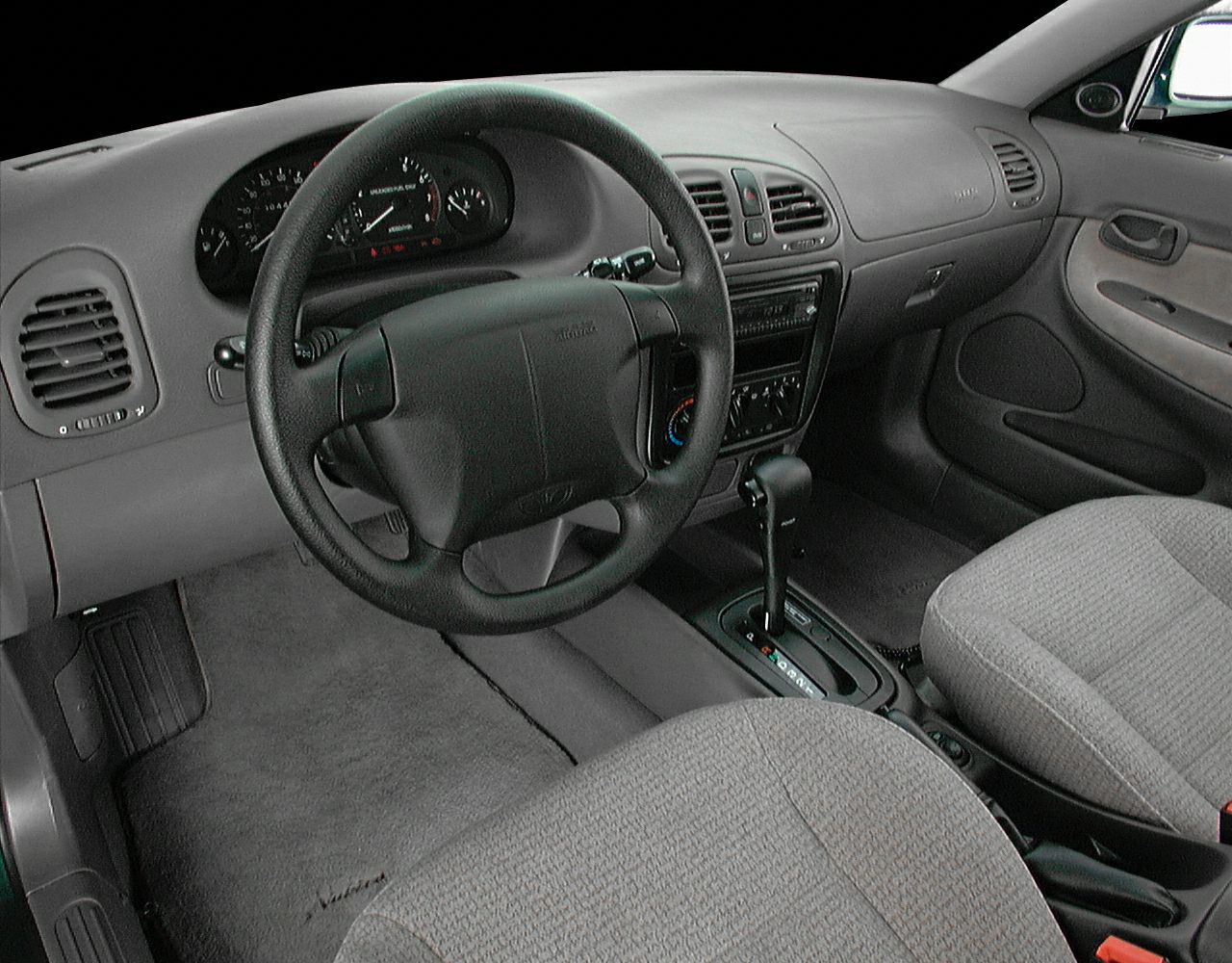 Steering wheel and automatic gear shift in vintage car interior