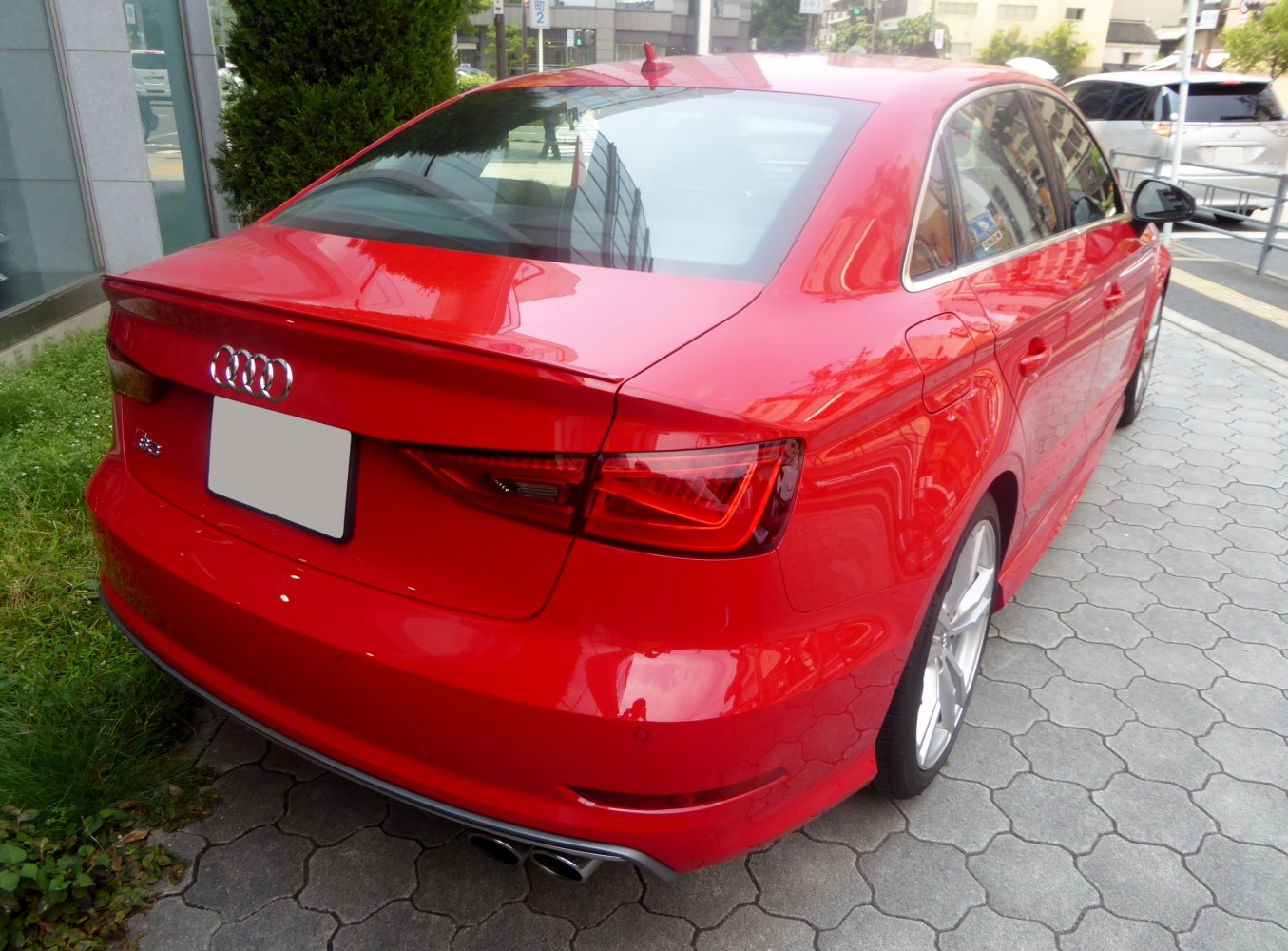 Red Audi S3 Sedan rear with quad exhausts and angular taillights