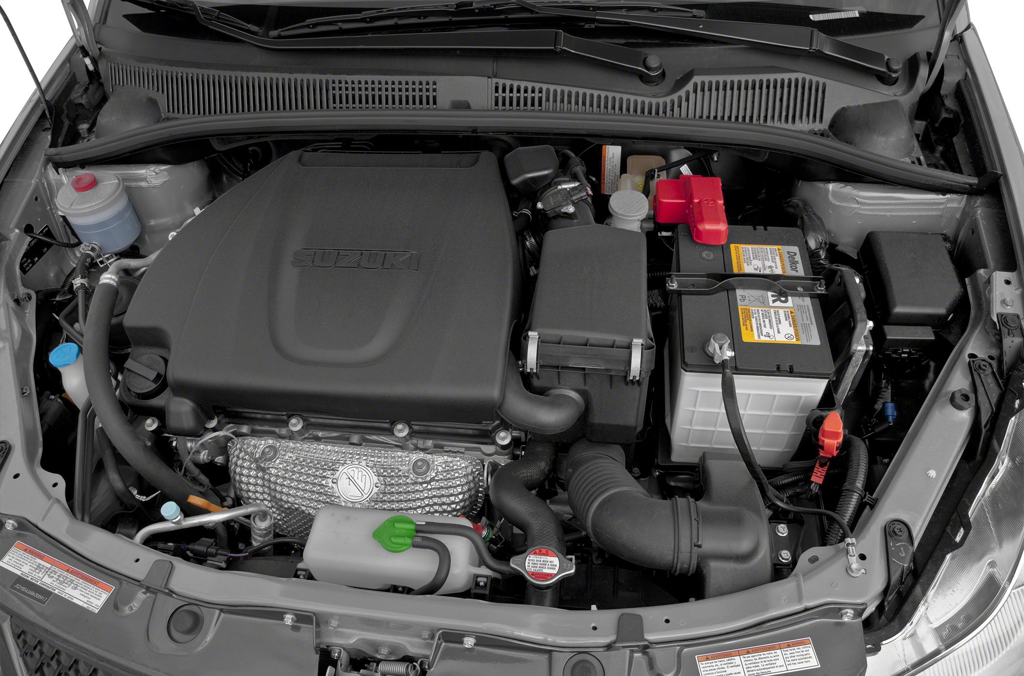 Engine bay with battery, air filter, and engine cover