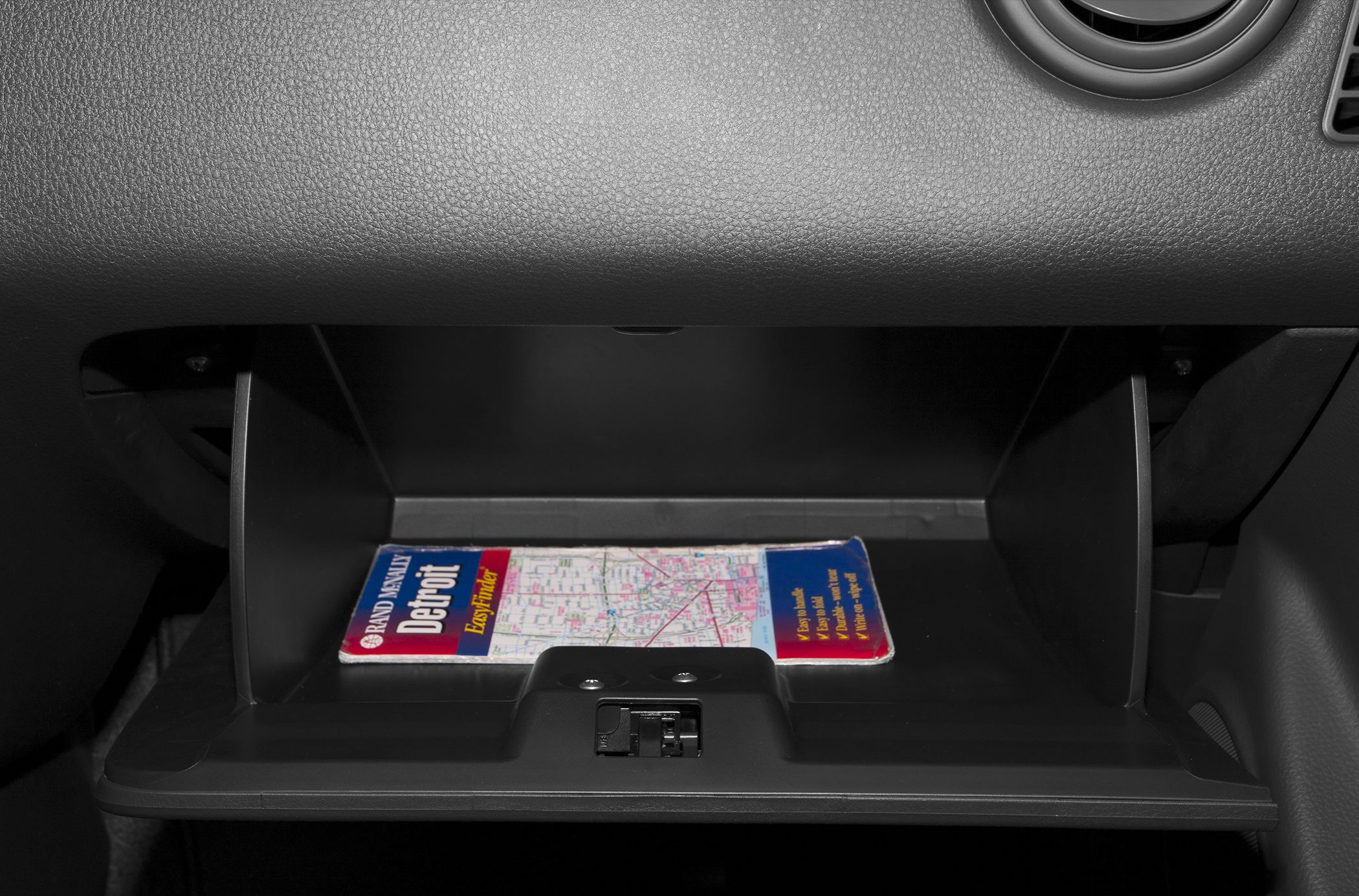 Glove compartment interior with map inside