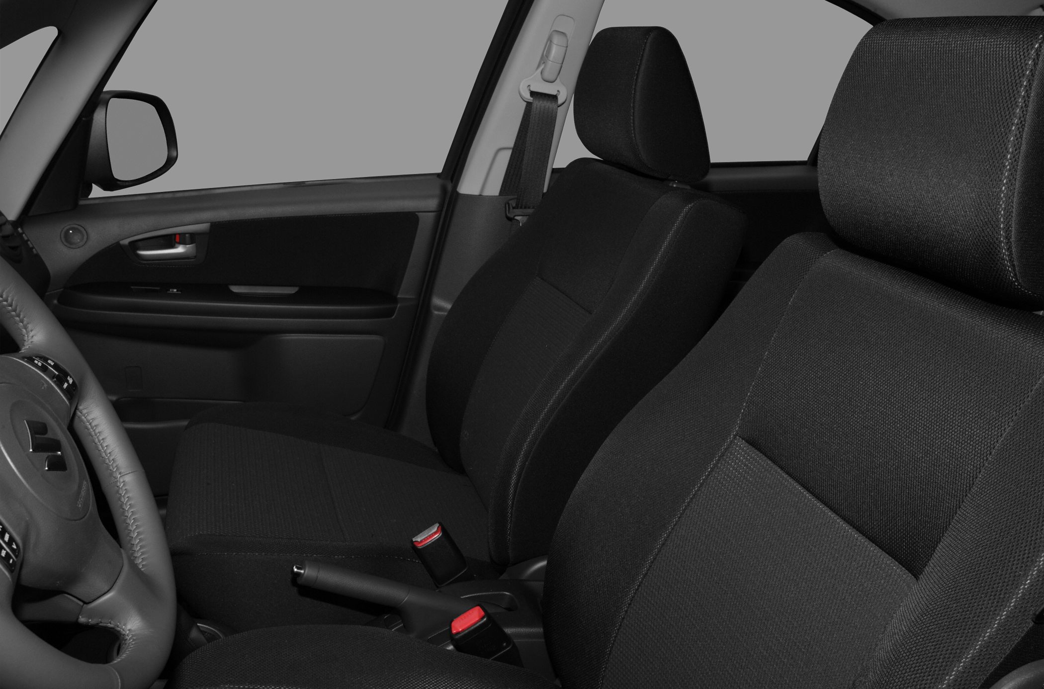 Front seats and interior door panel with seat belts and upholstery