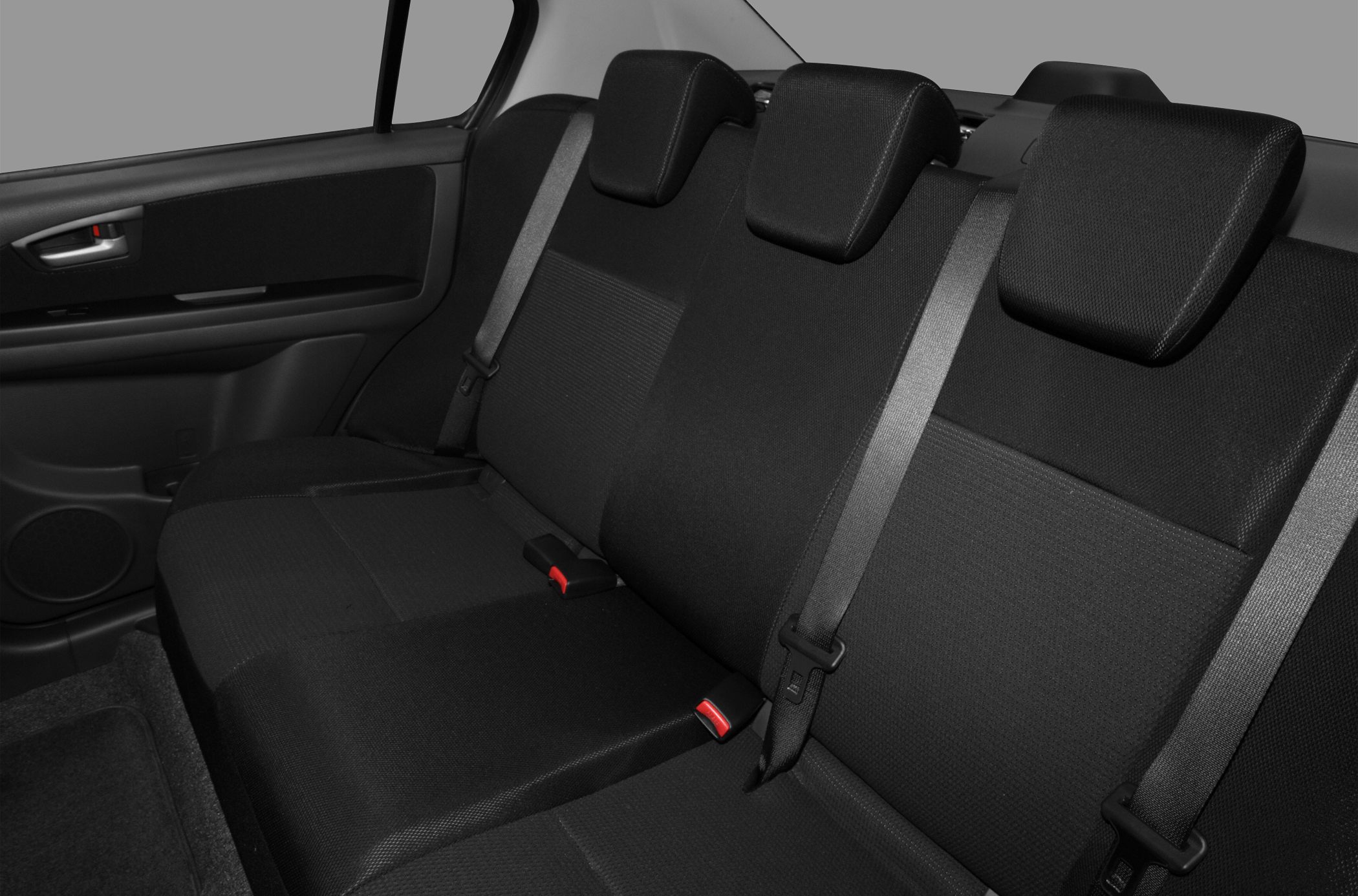 Rear seat interior with three headrests and seat belts