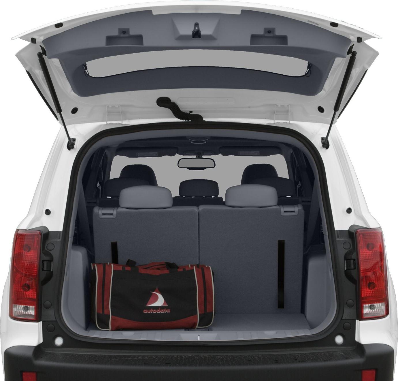 Open rear hatch, spacious cargo area with foldable seats and a duffel bag