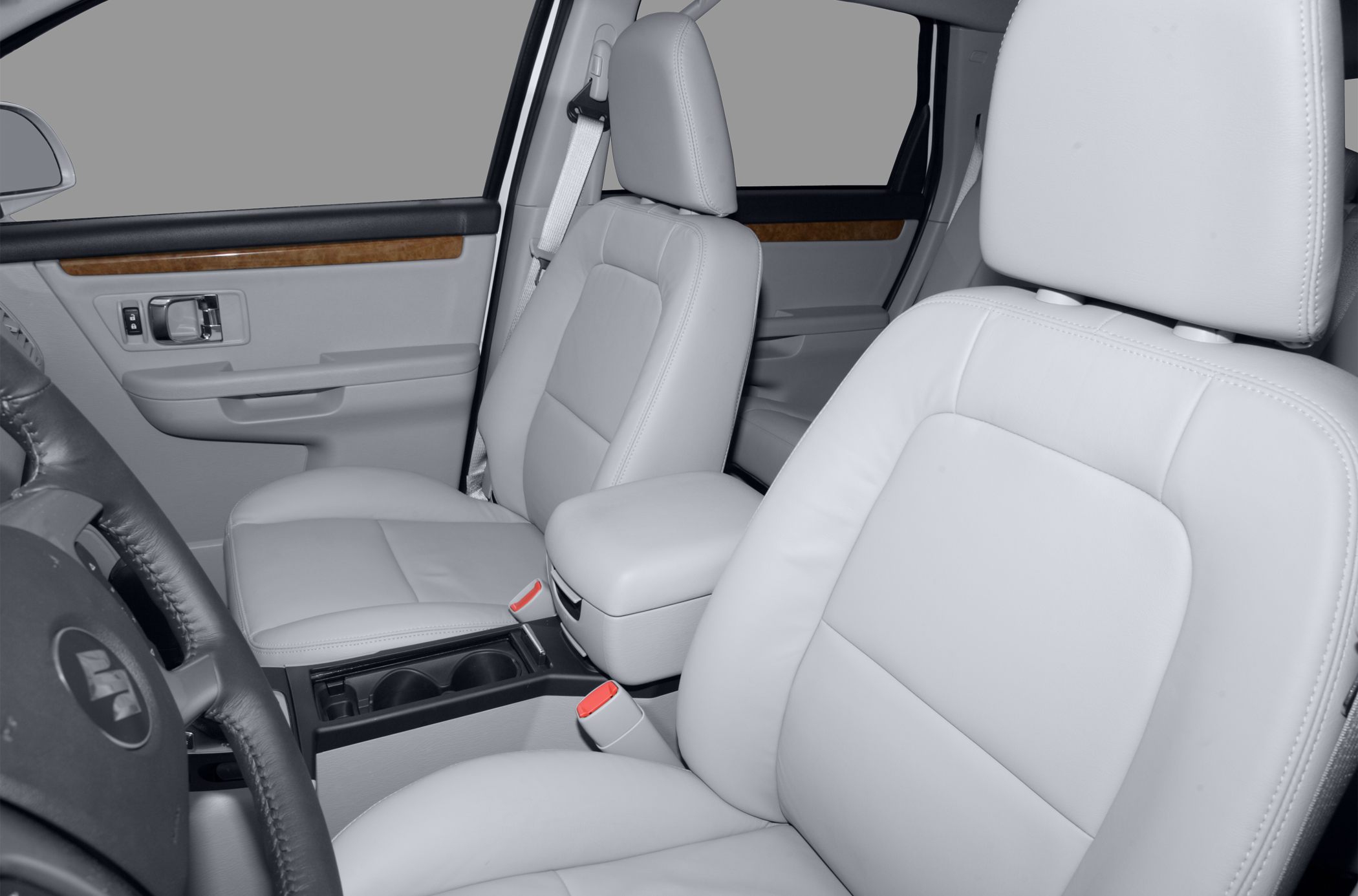Front seats with leather upholstery and central armrest.