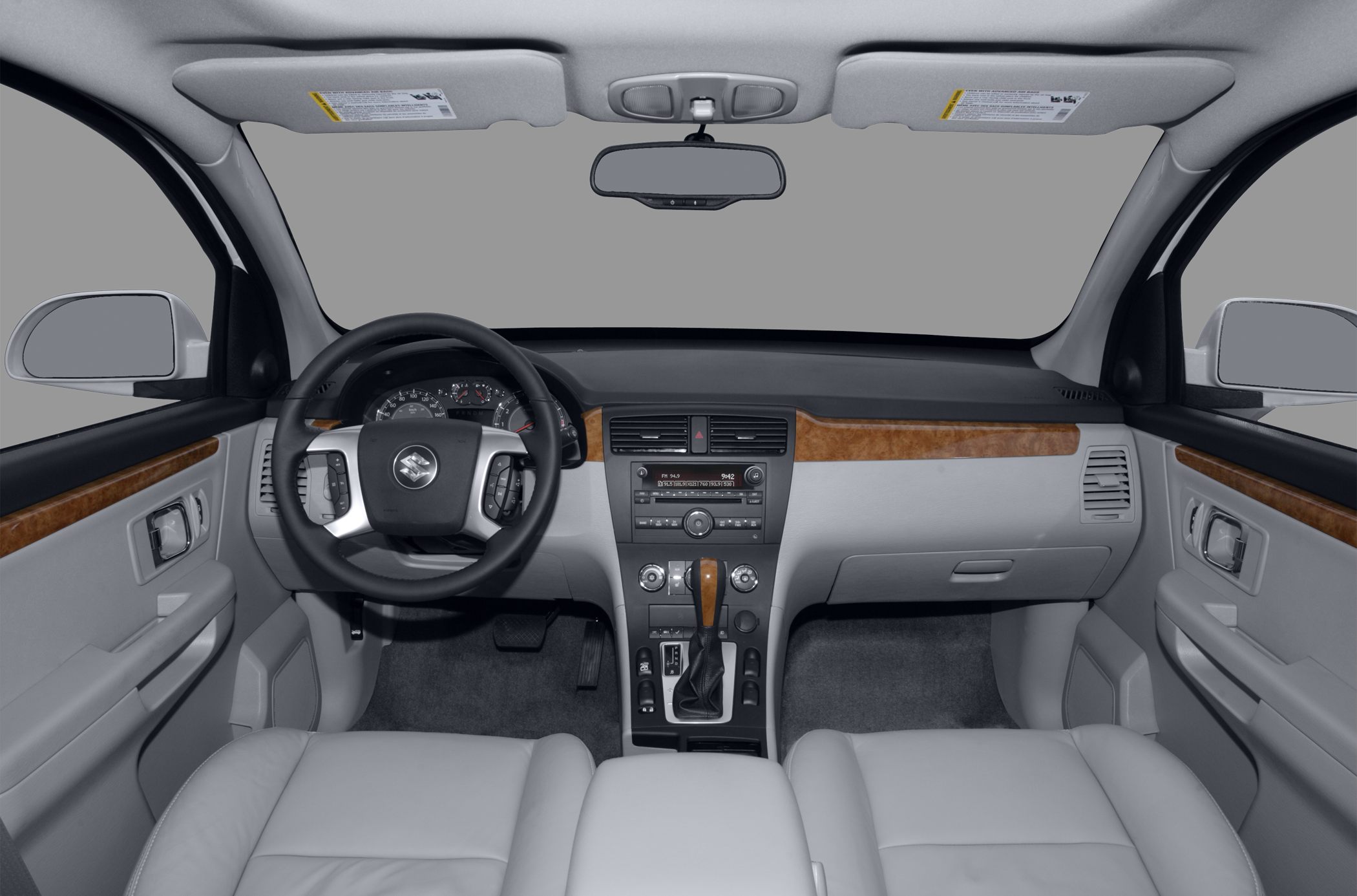 Dashboard and steering wheel with wood trim and control buttons