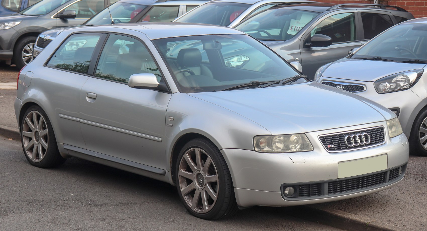 Silver hatchback with distinctive Audi grille and alloy wheels