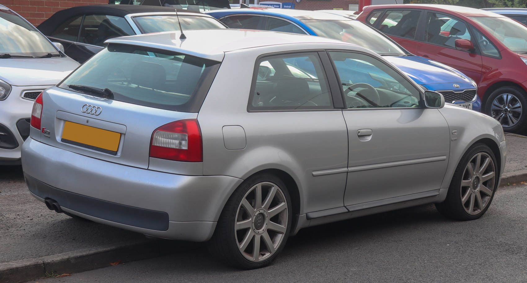 Silver 3-door hatchback rear view with alloy wheels and tail lights