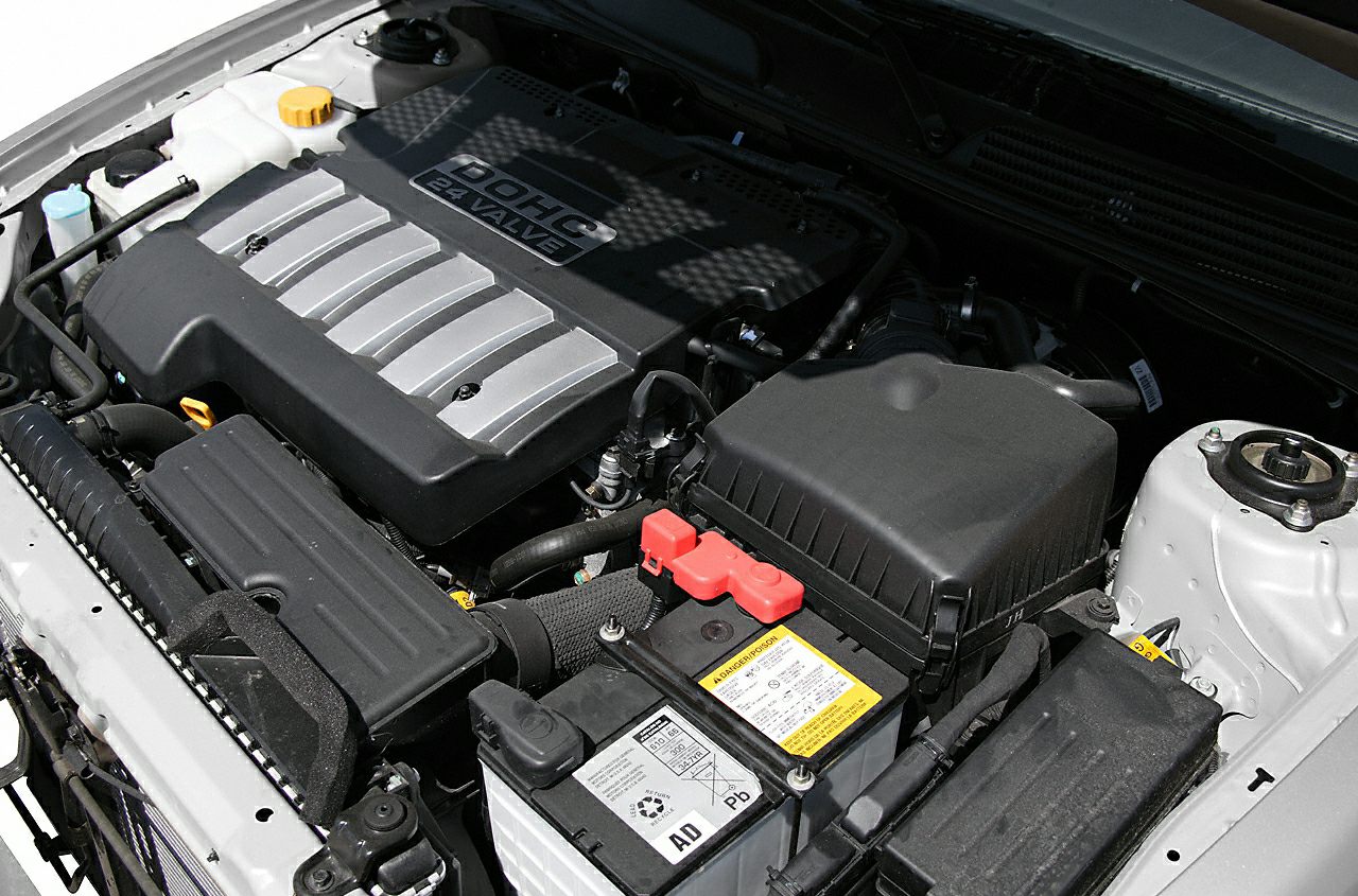 DOHC 24 valve engine and battery in engine bay.