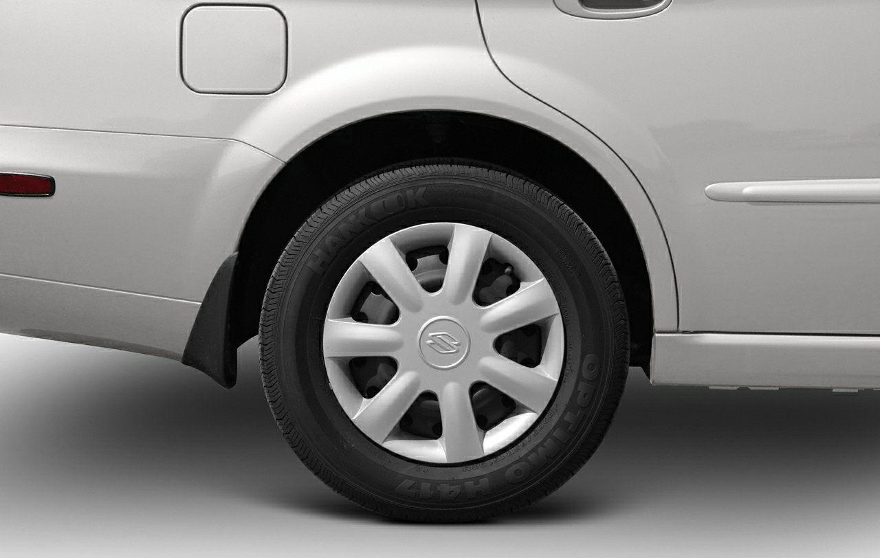 Rear left wheel with plastic hubcap and Hankook tire