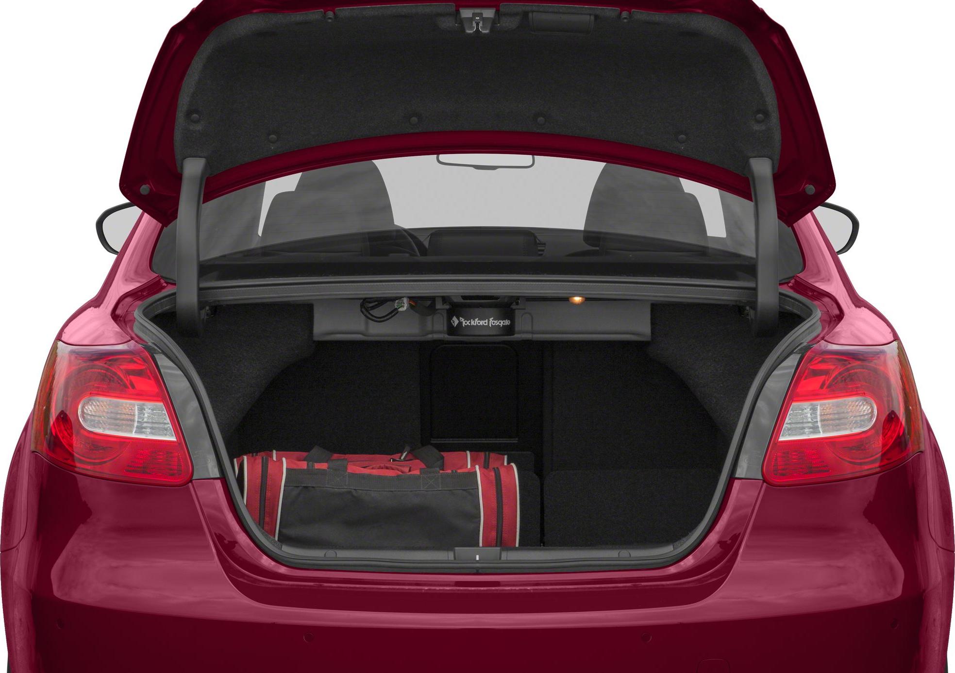 Open trunk with folded rear seats and red-black duffel bag inside