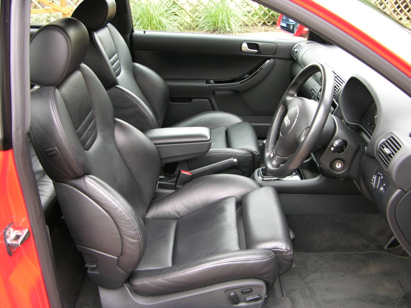 Sporty black leather seats and driver-focused cockpit interior