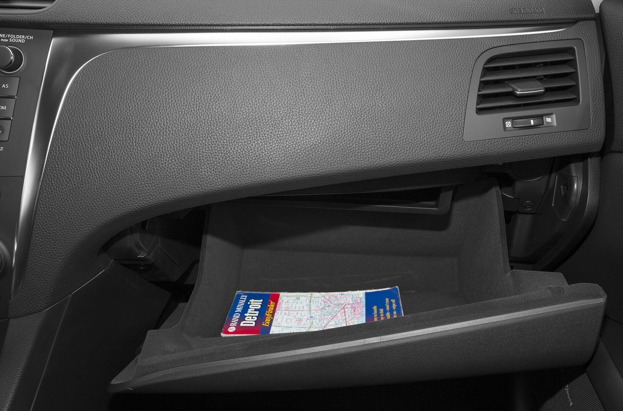 Interior glove box with a map inside the passenger compartment