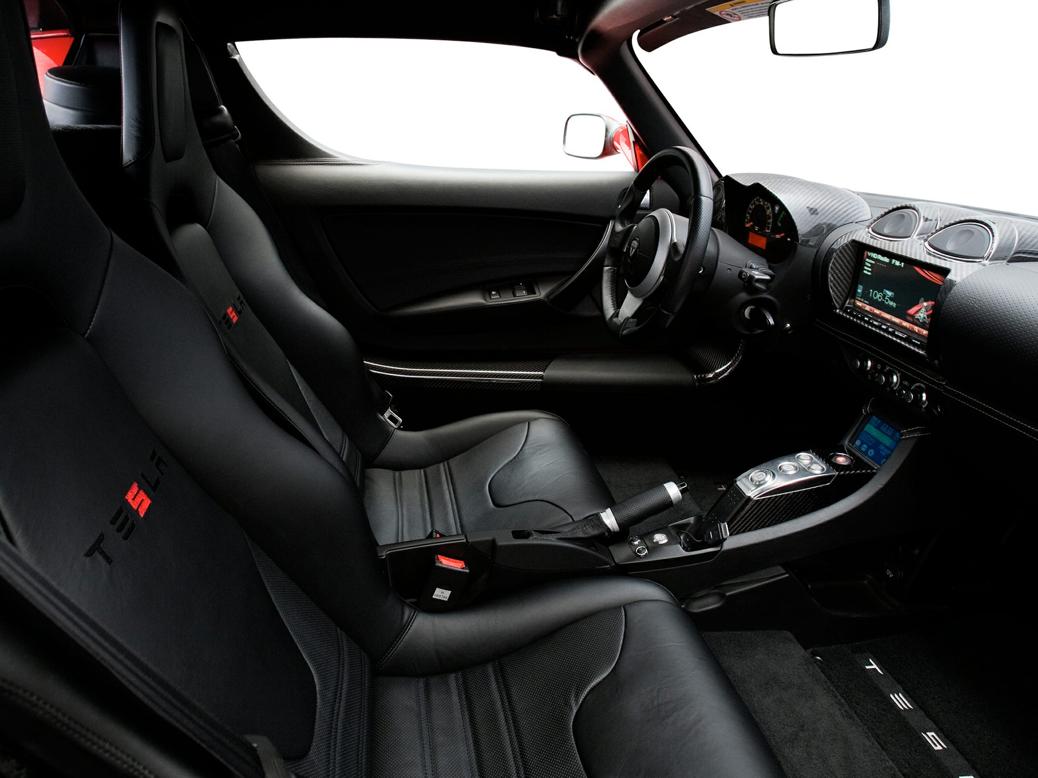 Carbon fiber dashboard and black leather sport seats interior