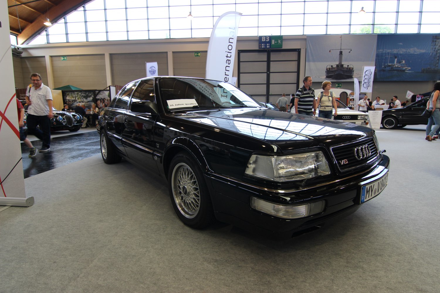 Black classic sedan with alloy wheels and distinctive 1980s front design