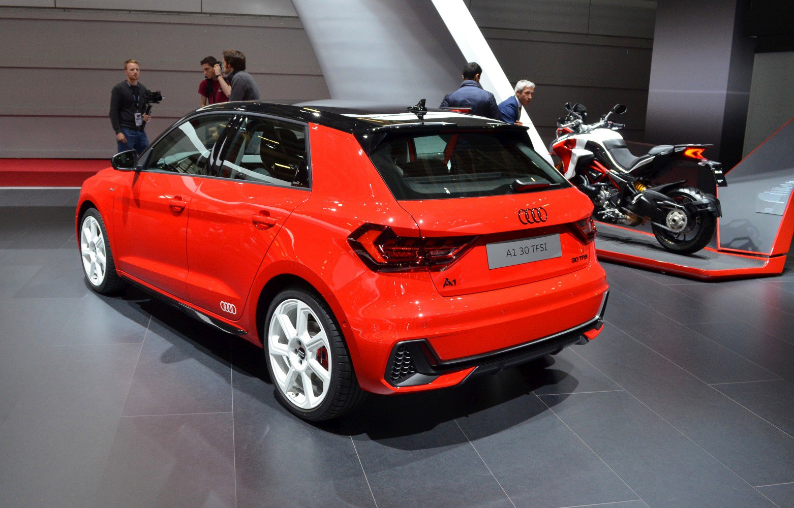 Rear view, white wheels, black roof, hatchback