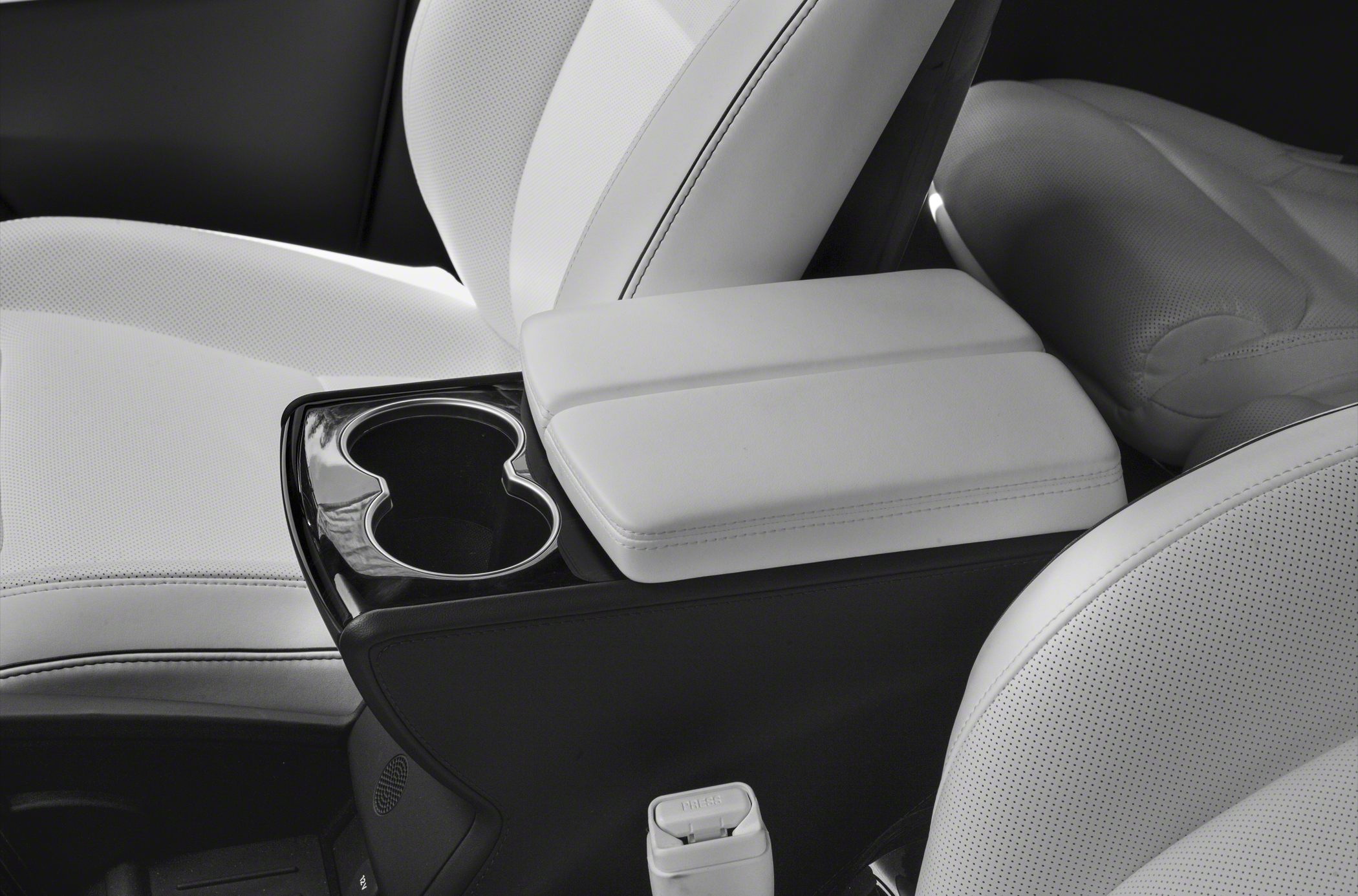 White leather center console with cup holders in car interior
