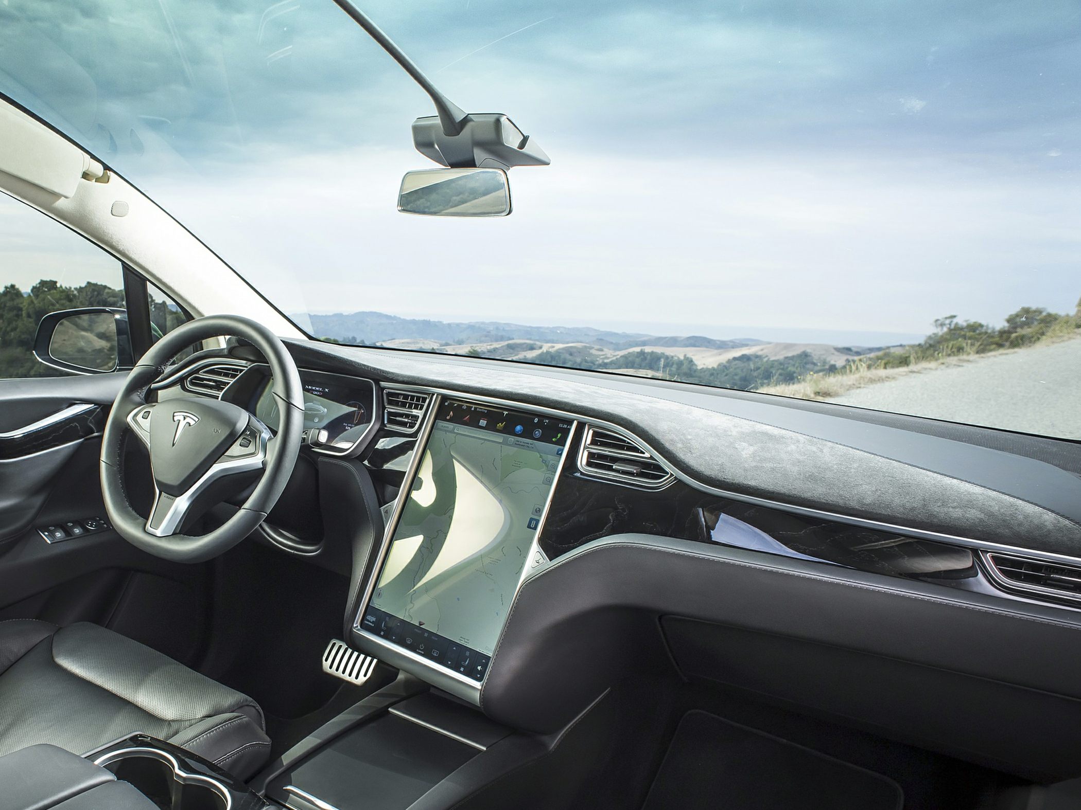 Large vertical touchscreen and minimalist dashboard interior
