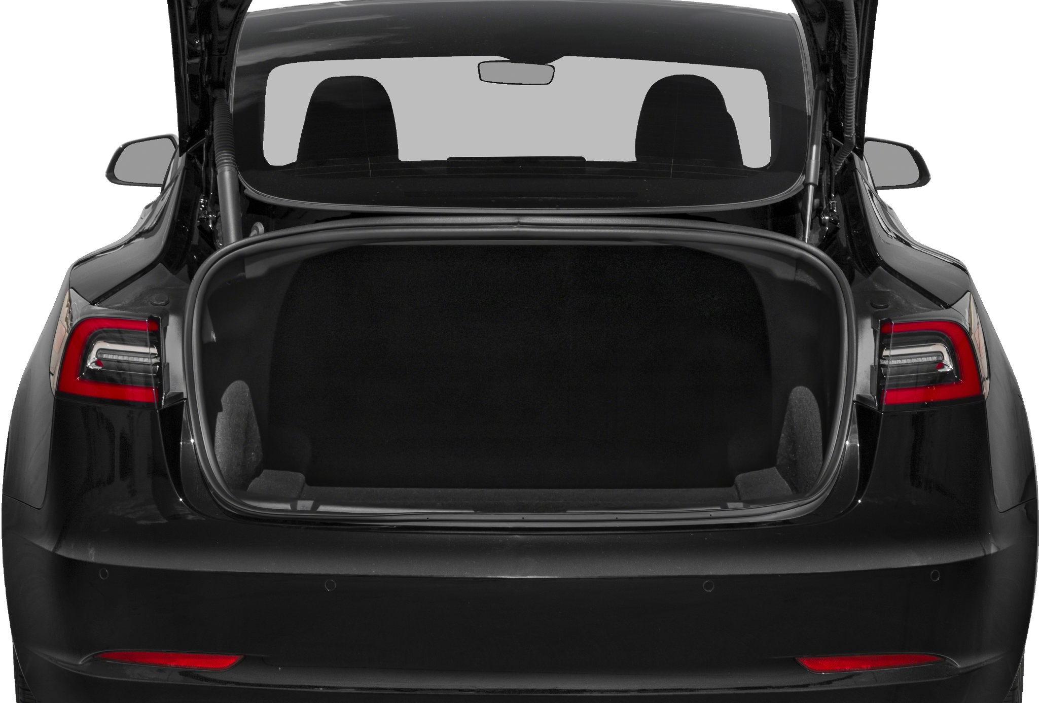 Open rear trunk of a modern electric sedan