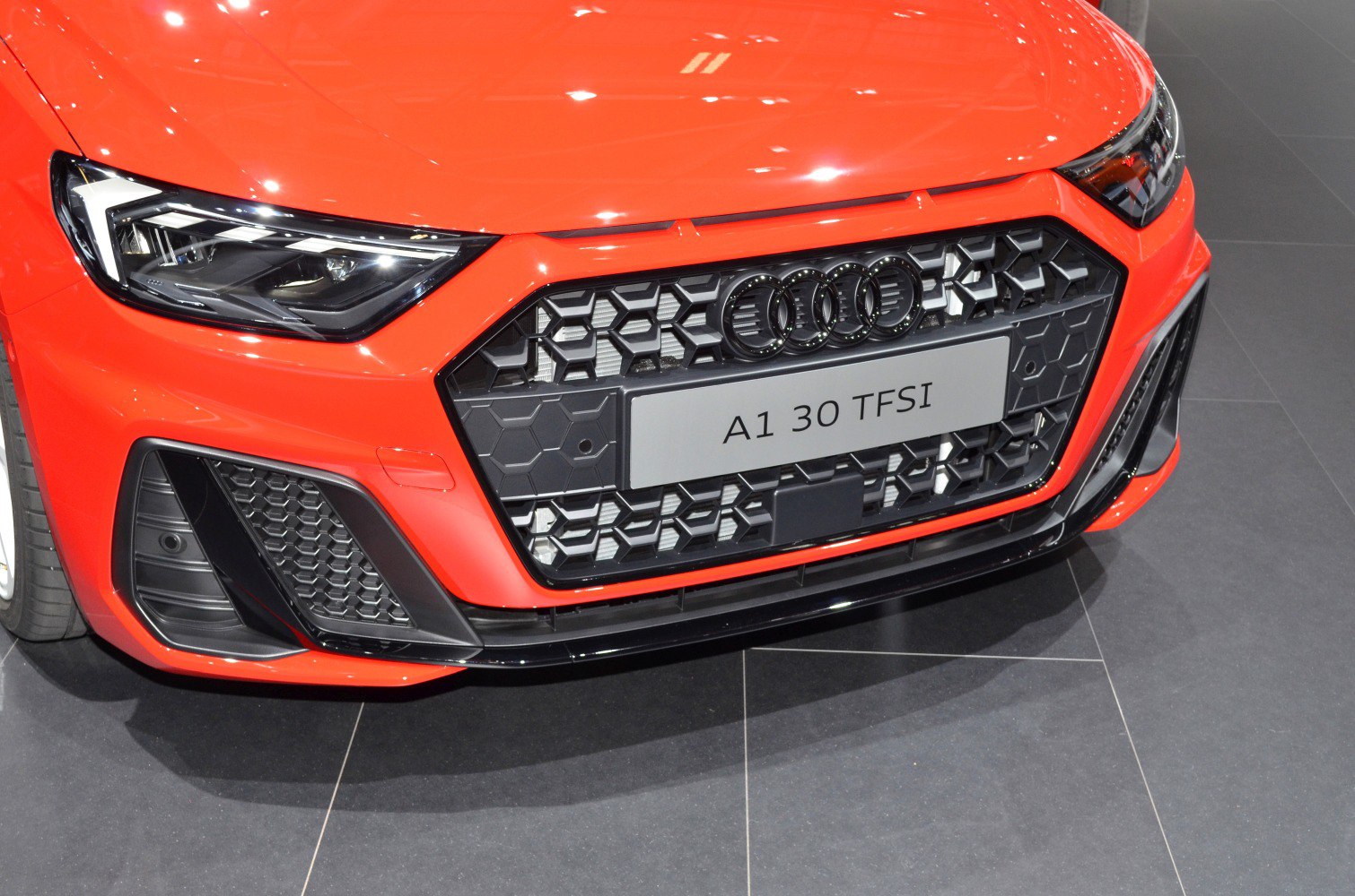 Sharp LED headlights and honeycomb grille with license plate