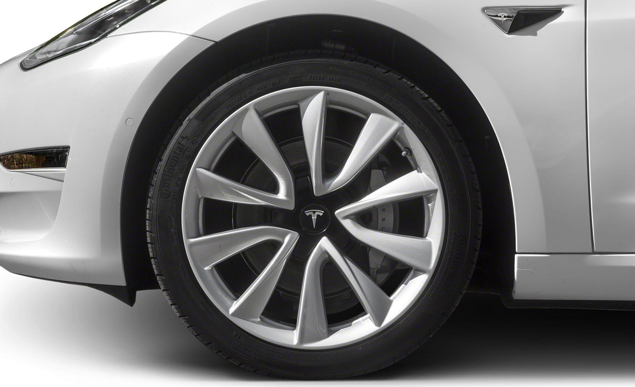 Close-up of alloy wheel rim and tire on modern car
