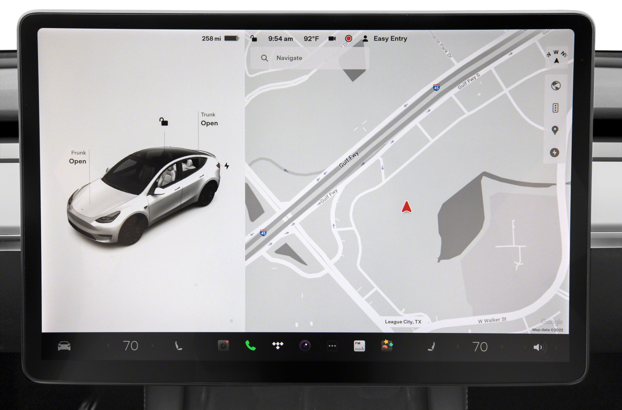 Electric car touchscreen displaying navigation and vehicle status
