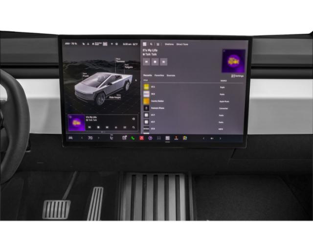 Large central touchscreen display and pedals in vehicle interior