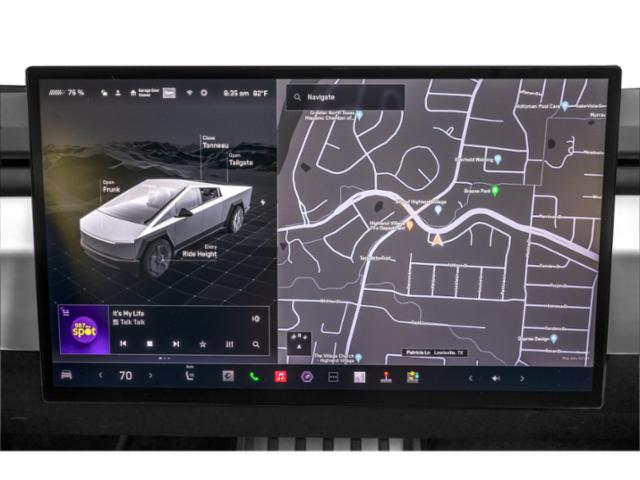 Large touchscreen display showing vehicle controls and navigation map