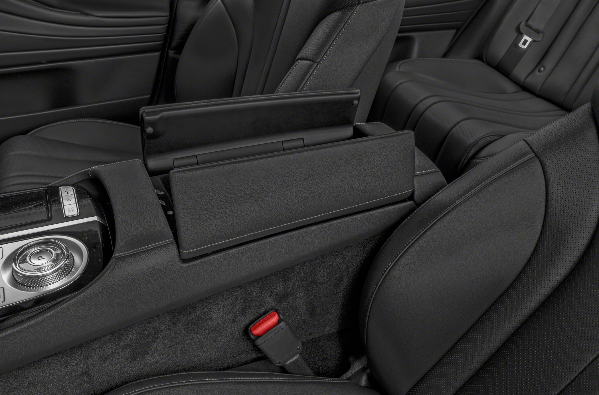 Rear center console and black leather seats interior detail