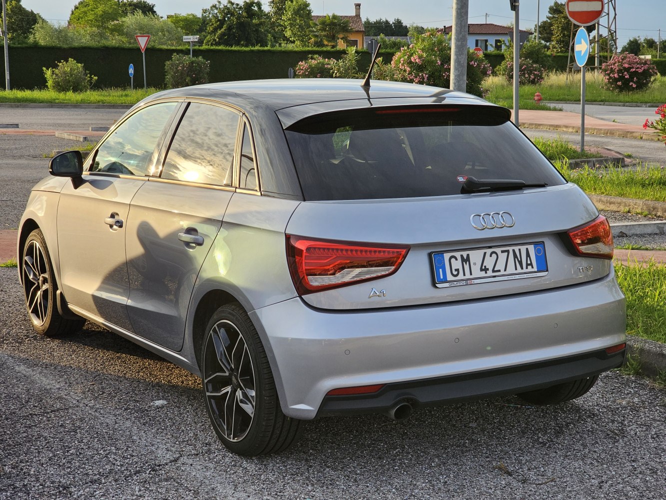 Rear and side view with taillights and alloy wheels