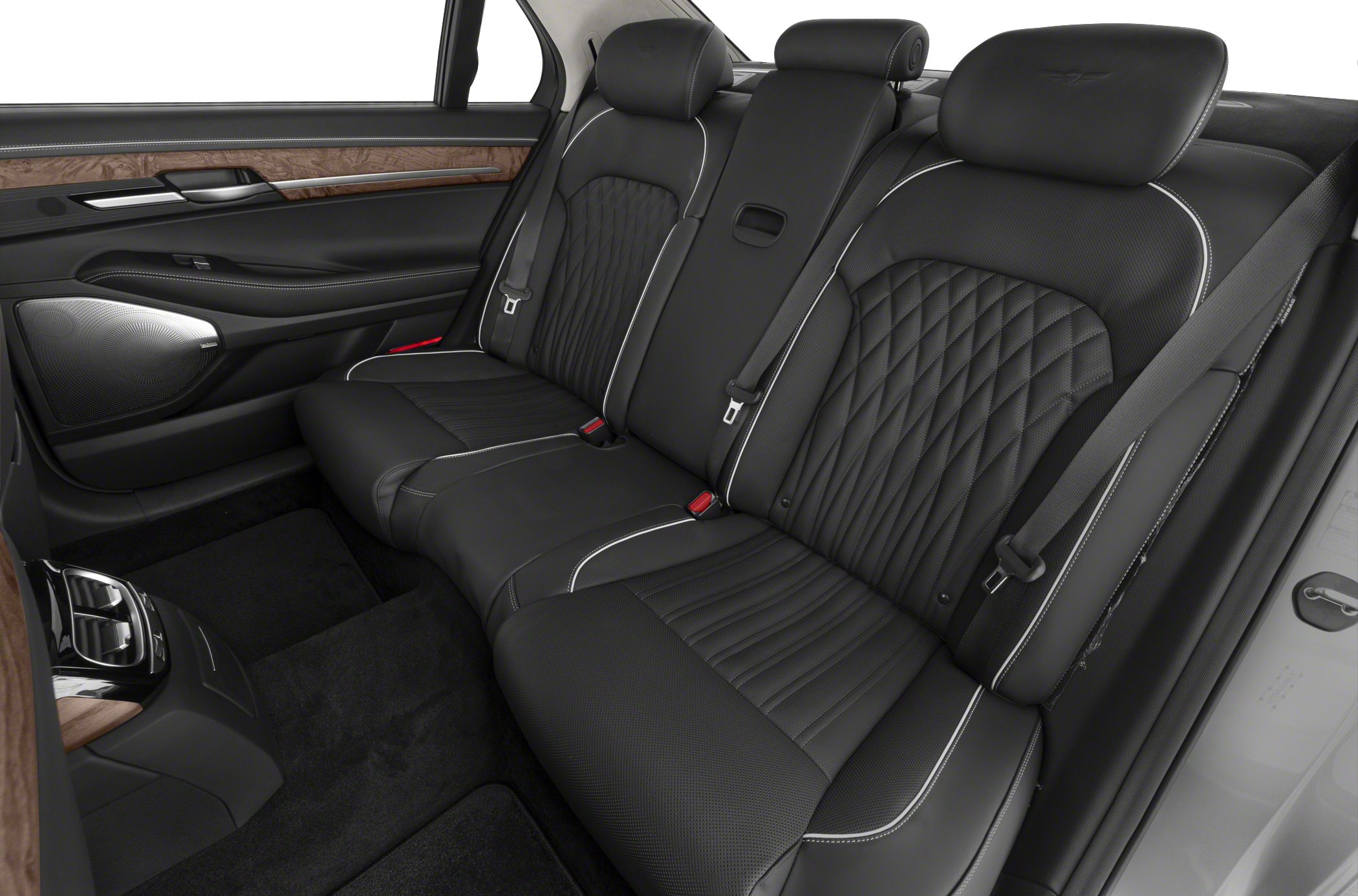 Quilted leather rear seats with wood trim and embossed headrests.