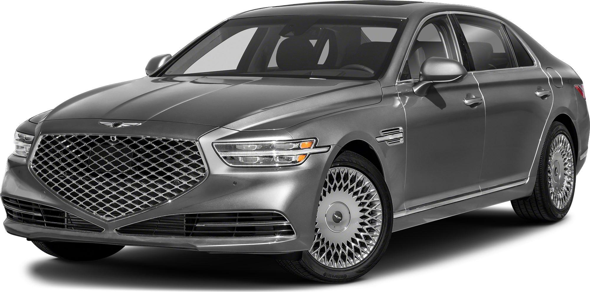 Large distinctive grille and intricate alloy wheels on luxury sedan.