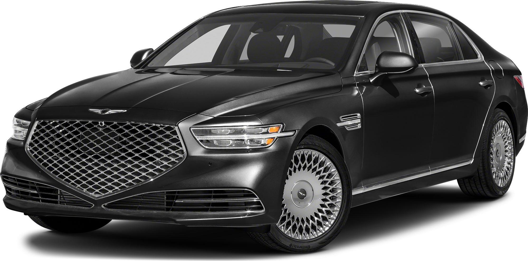 Luxury sedan front view with large mesh grille and multi-spoke alloy wheels