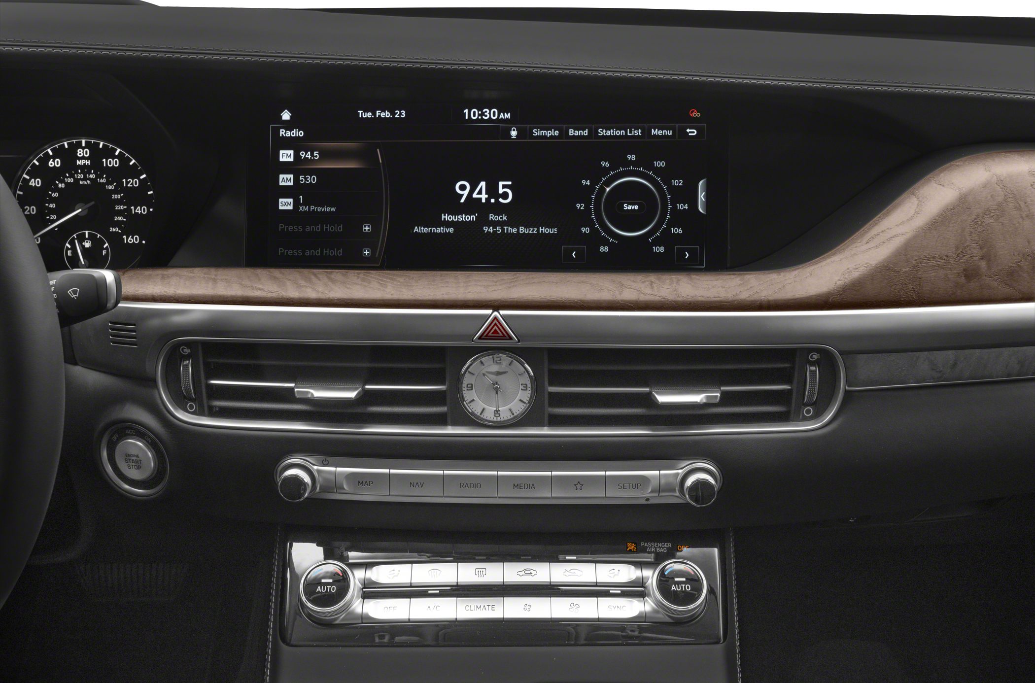 Luxury car interior with digital display and analog clock