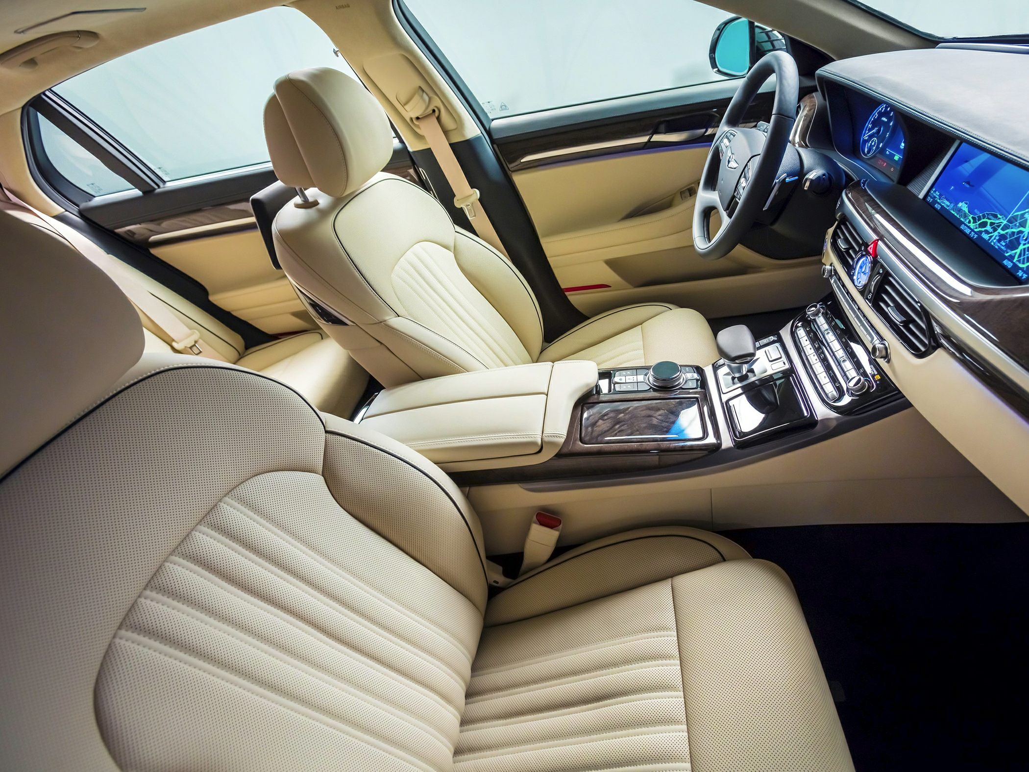 Beige leather seats and advanced digital dashboard with wood trim