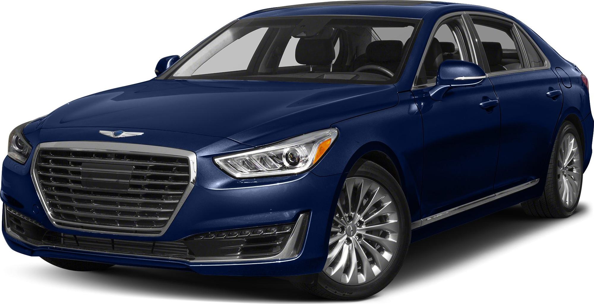 Chrome grille and multi-spoke alloy wheels on luxury sedan front-side.
