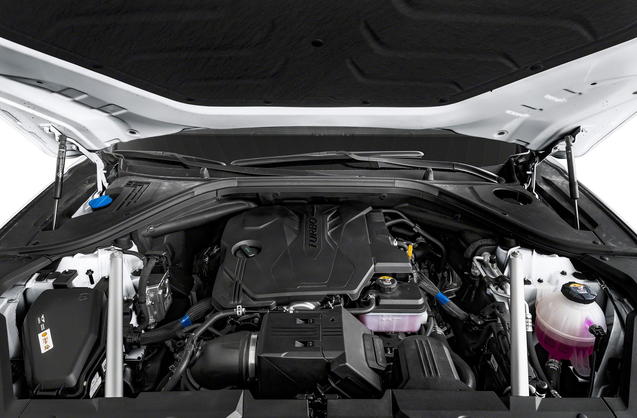 Turbocharged engine bay with components and fluid reservoirs