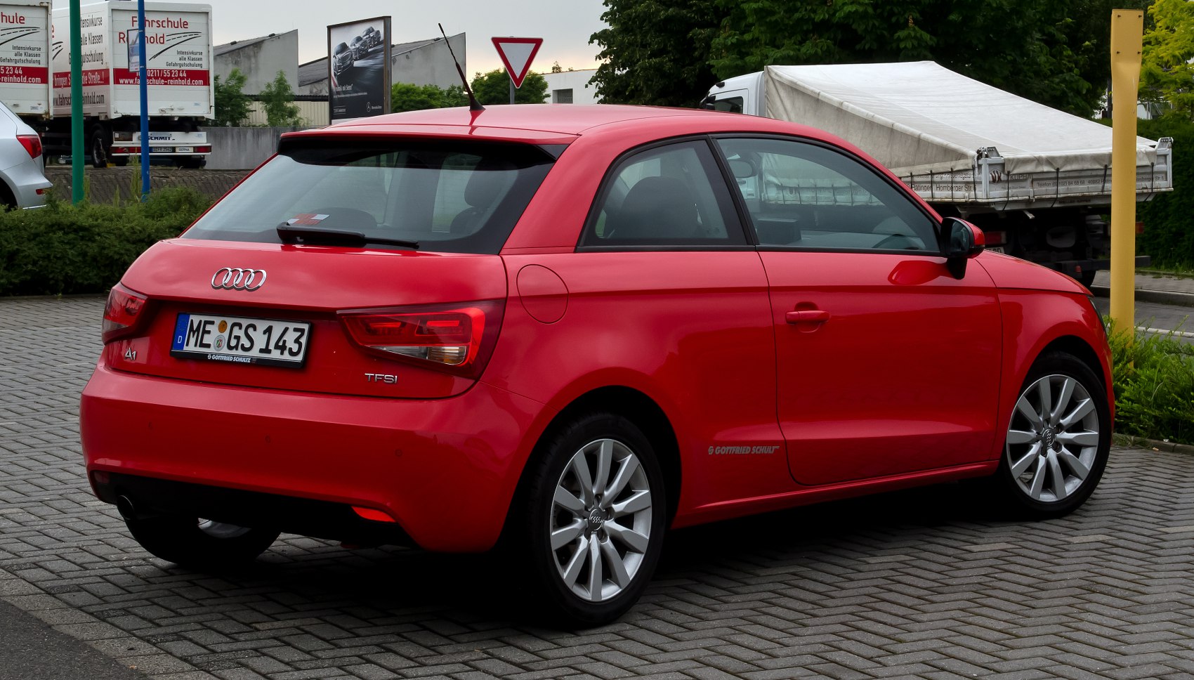 Rear view of red red hatchback with alloy wheels and TFSI badge