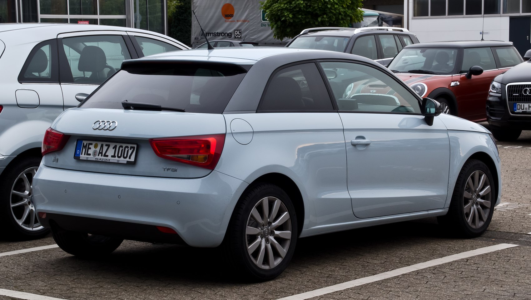 Rear and side view of compact hatchback with alloy wheels