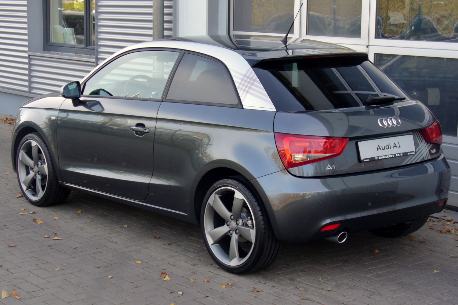 Rear side view with signature silver C-pillar and alloy wheels