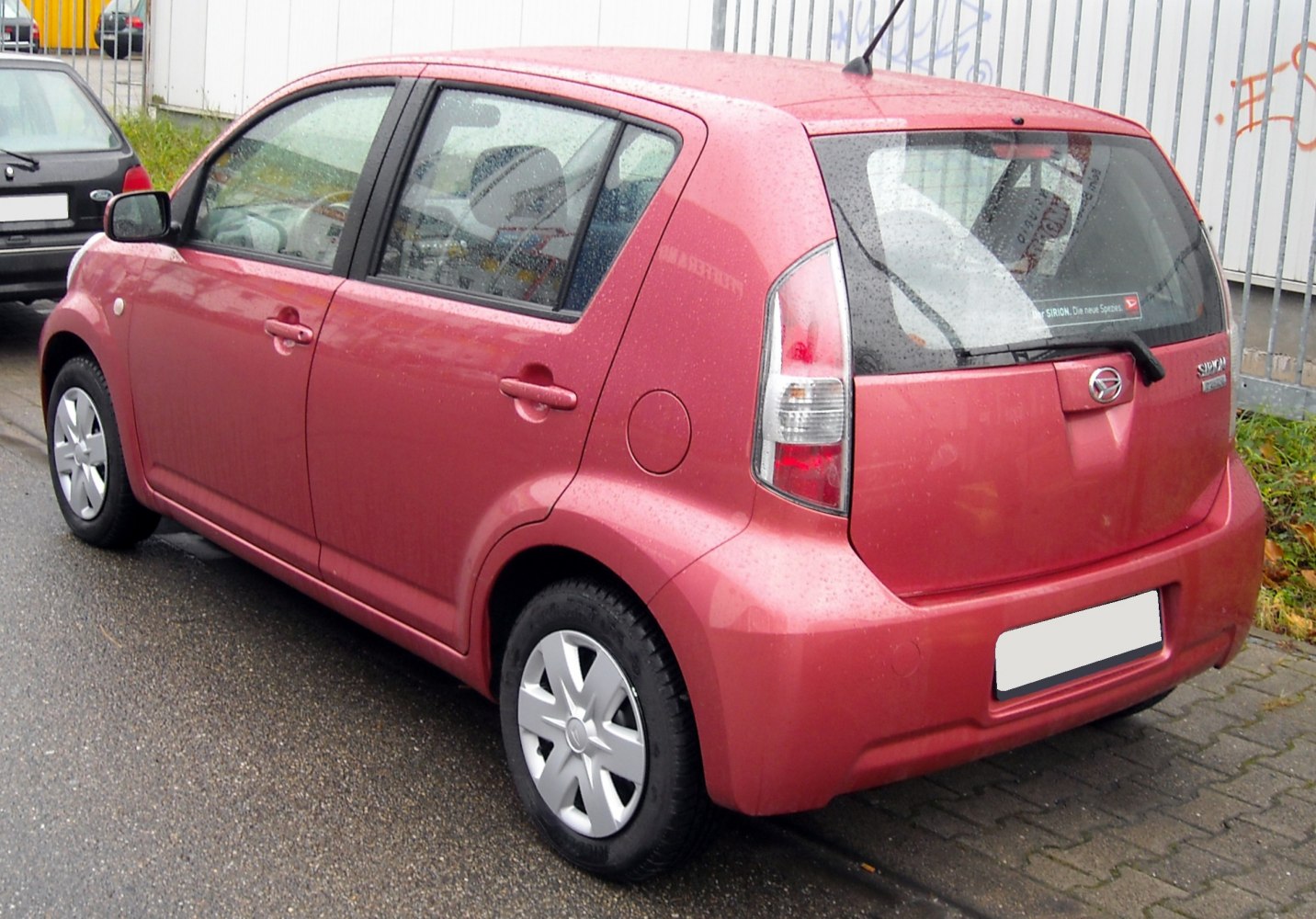 Rear and side view of a compact five-door hatchback with distinctive taillights.